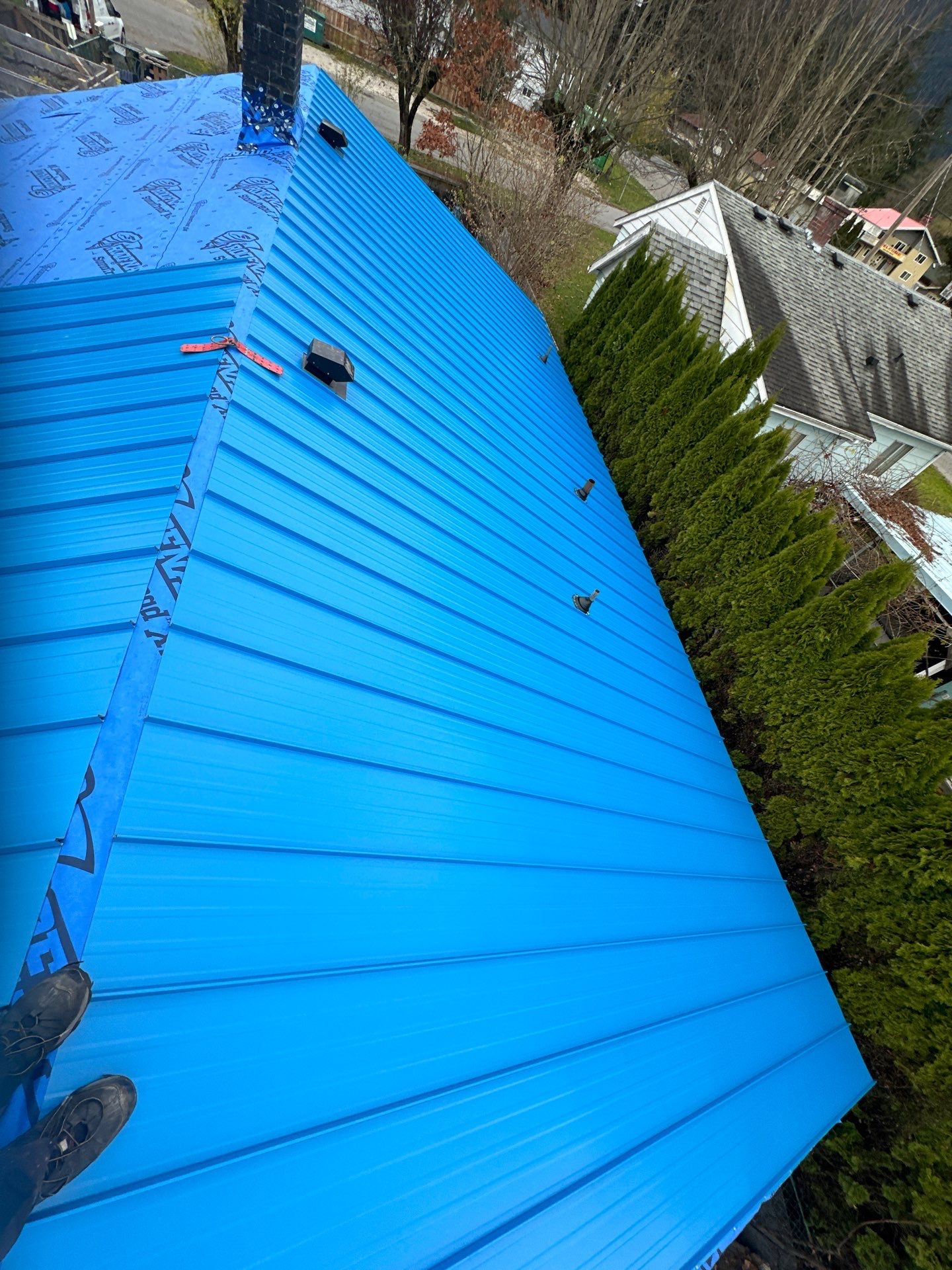 Residential Re-Roof using 12" Prolok metal  by Top Notch Roofing Inc