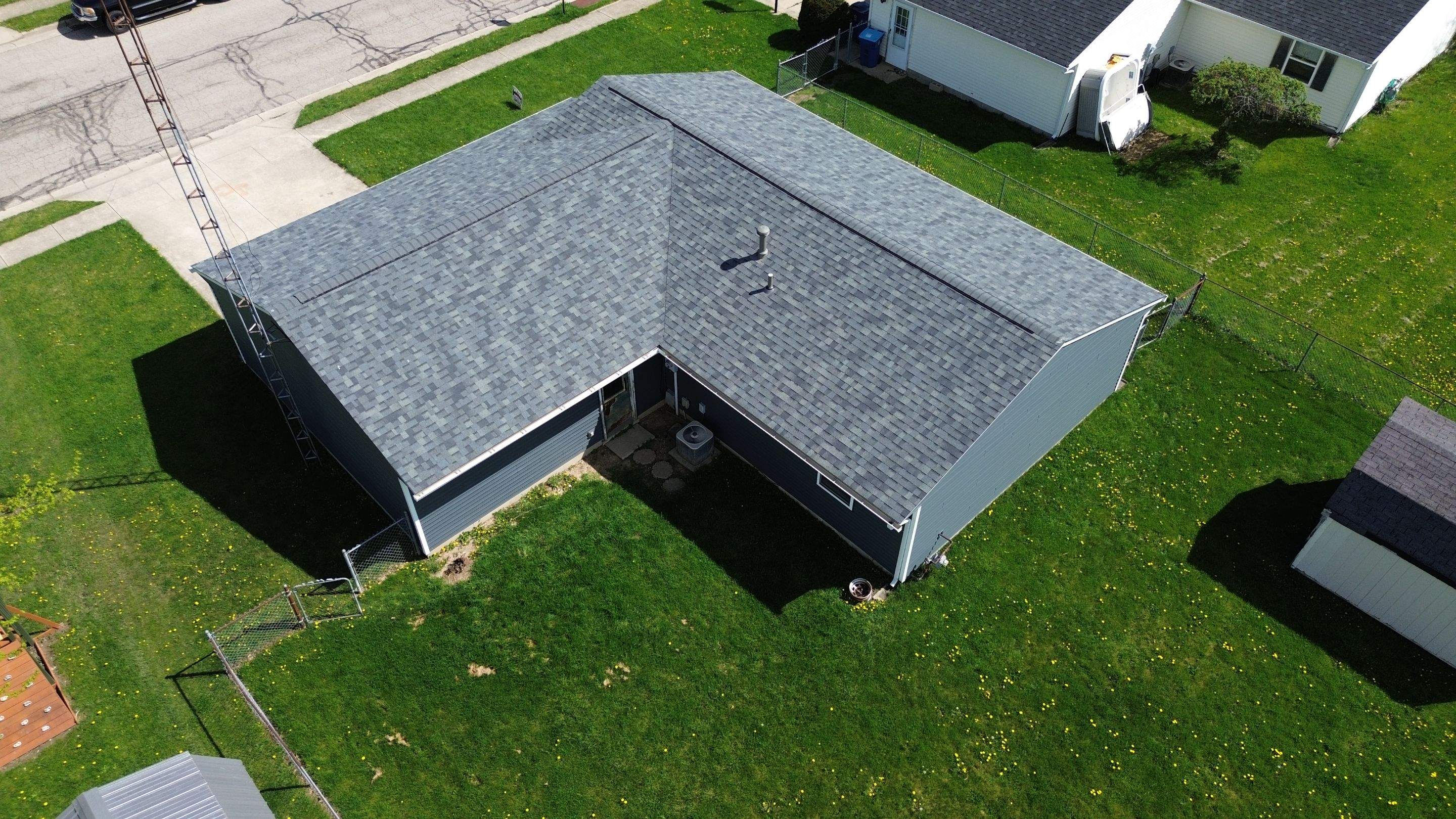 Storm Damage Residential Roof and Siding Installation by WIW Enterprises Inc