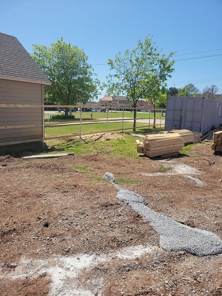 Cedar Fence using Cedar Pickets and Metal Poles by Clays Services Inc