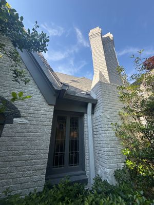 Residential Gutter Installation and Exterior Maintenance for Dallas White Brick Home