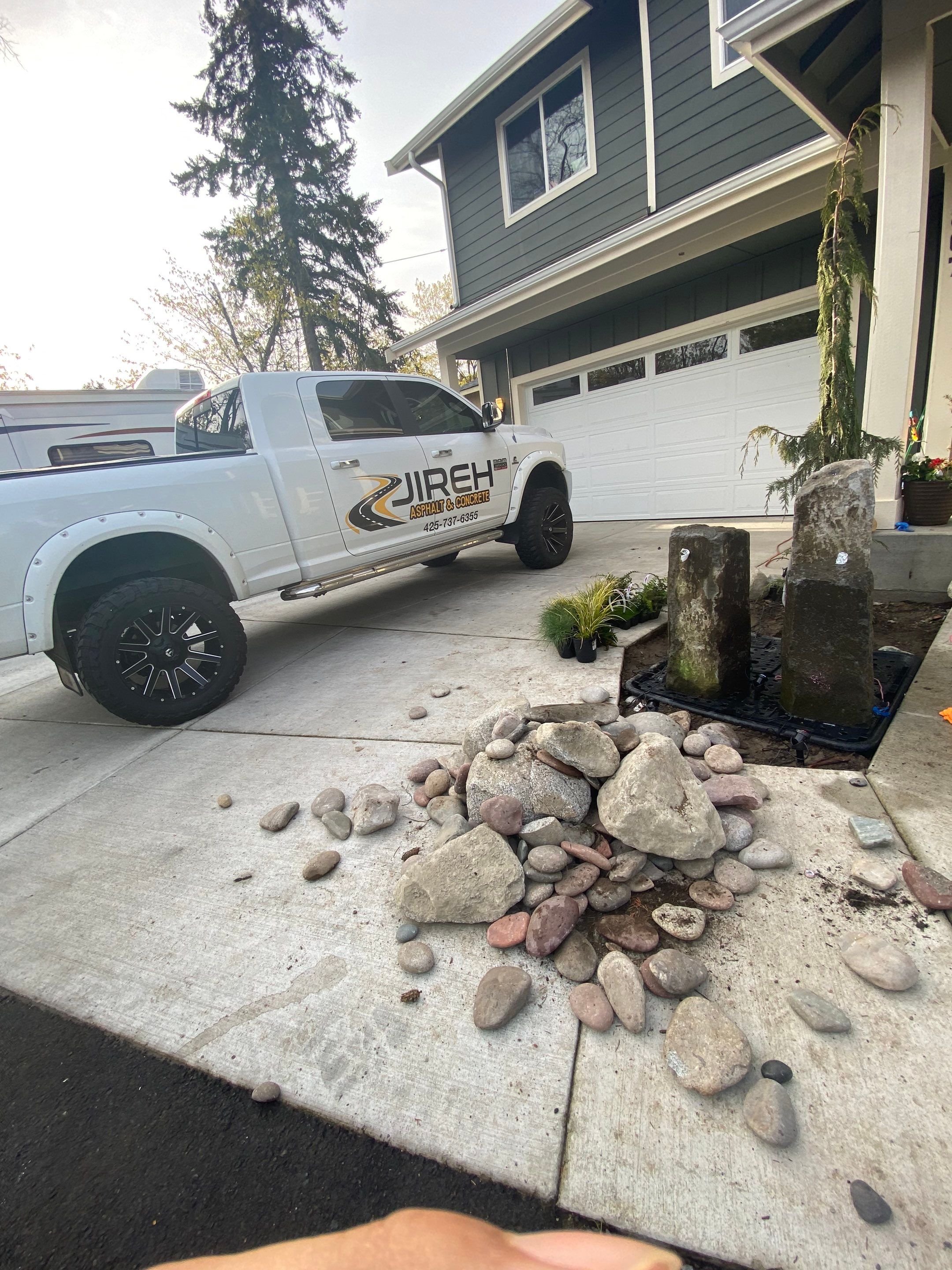 Patio Installation using Concrete, Retaining walls, and Turf install by Jireh Asphalt & Concrete Inc 