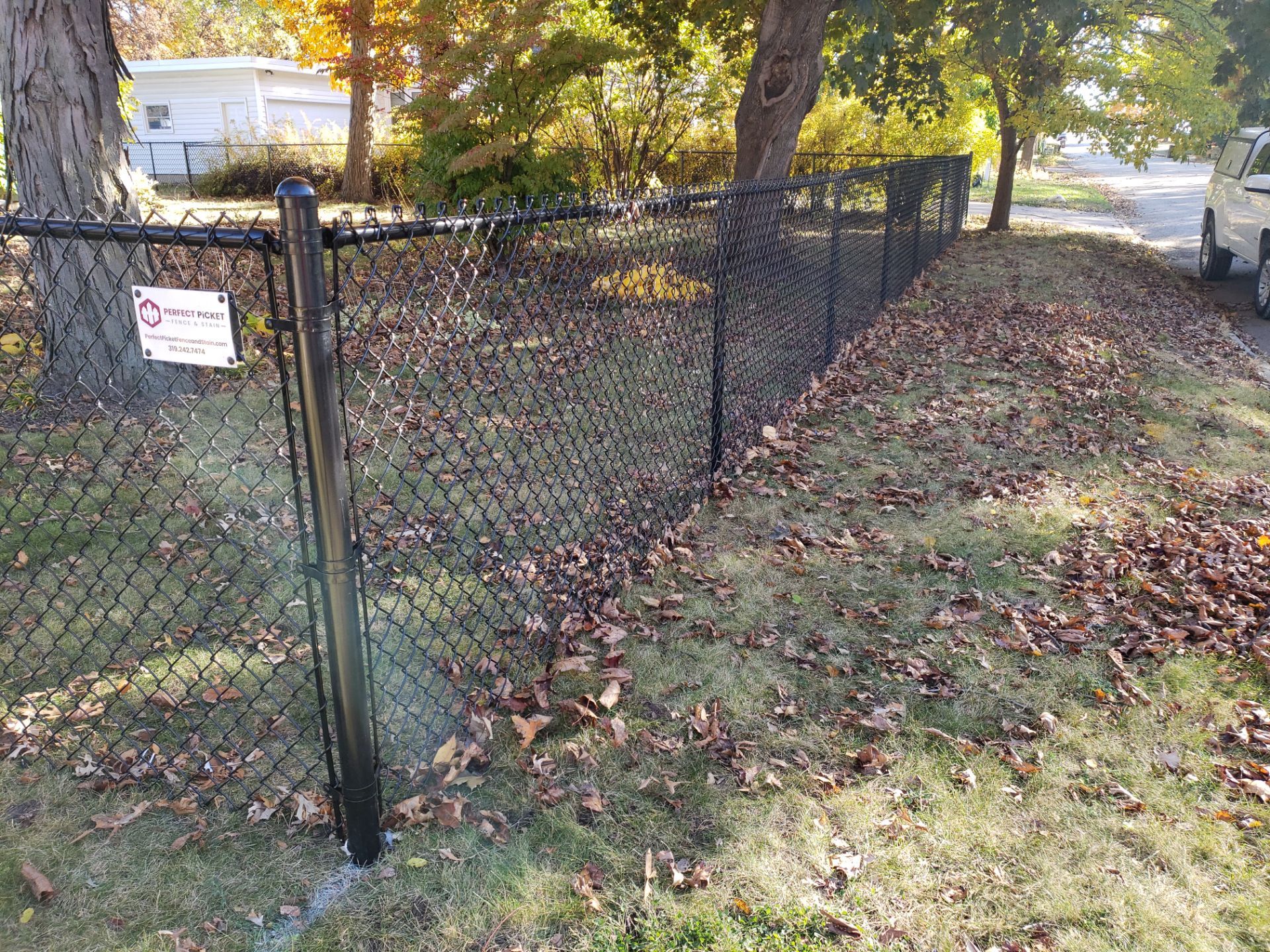 Black Chain Link Fence Installation in Cedar Falls, Iowa by Perfect Picket Fence and Stain