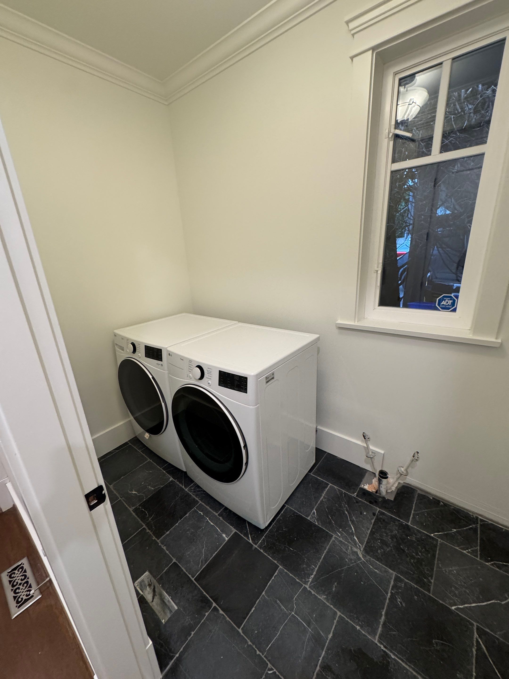 High-End Laundry Room Renovation and Restoration in Vancouver by YVR Construction Group