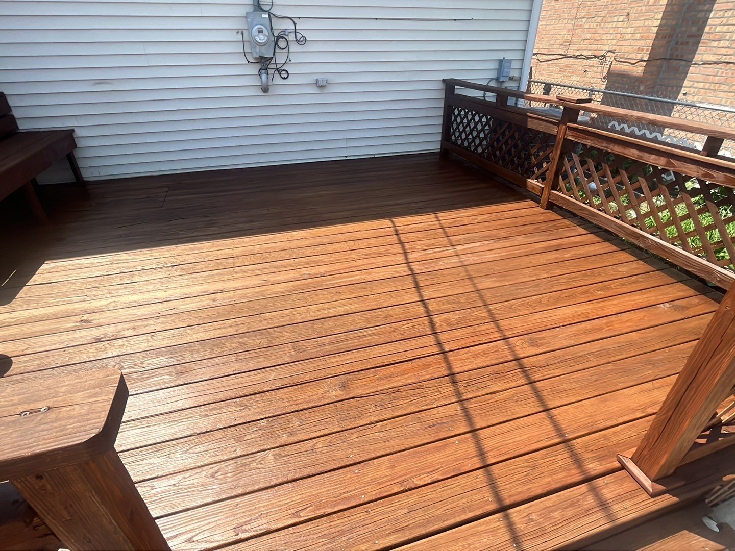 Wood cleaning and staining using Armstrong cloark oil stain by Northern Power Washing LLC.