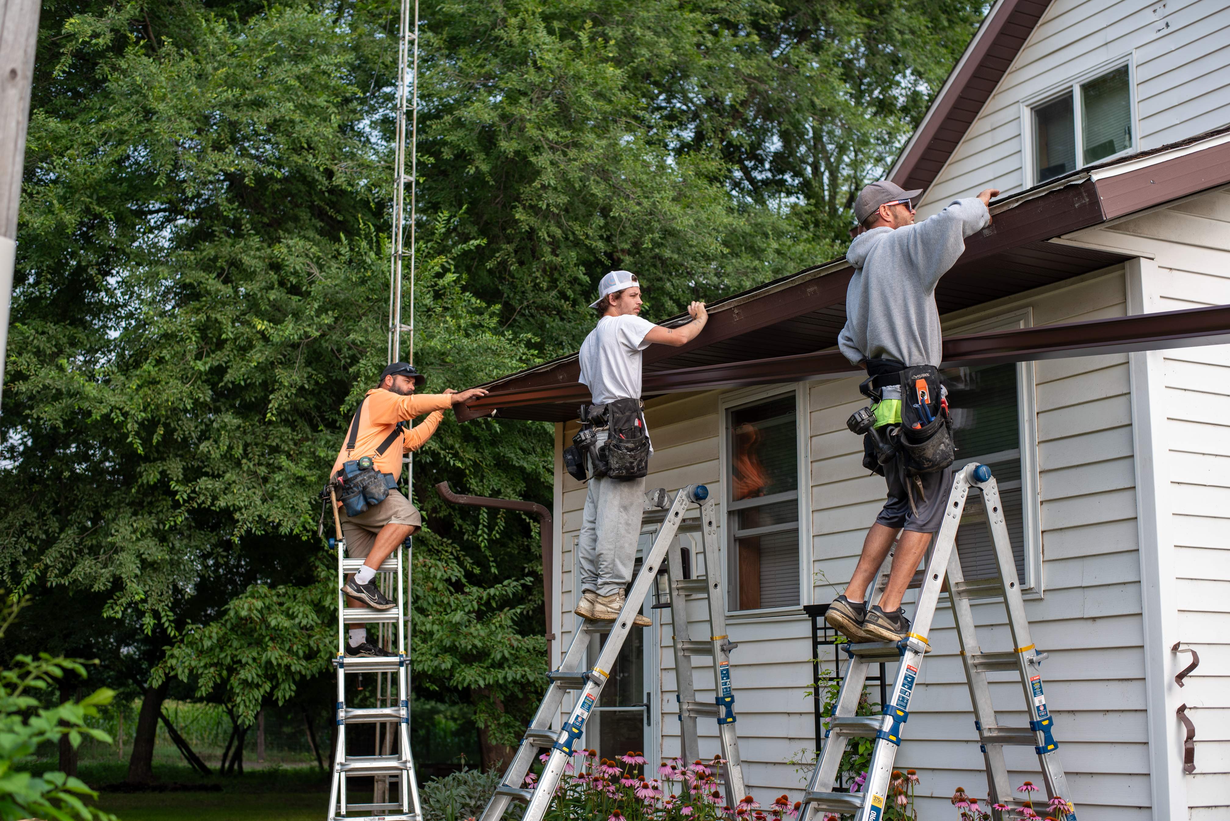 Royal Granite Siding Replacement & Brown Seamless Gutters by Next Level Seamless Gutters / Exteriors Inc.