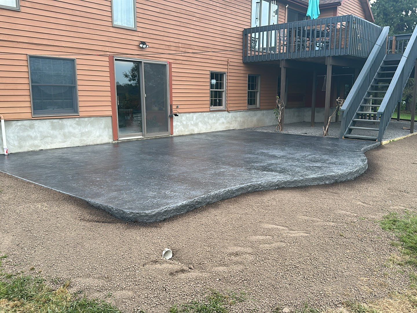 Bluestone textured concrete stamped patio  by NG Masonry & Construction LLC