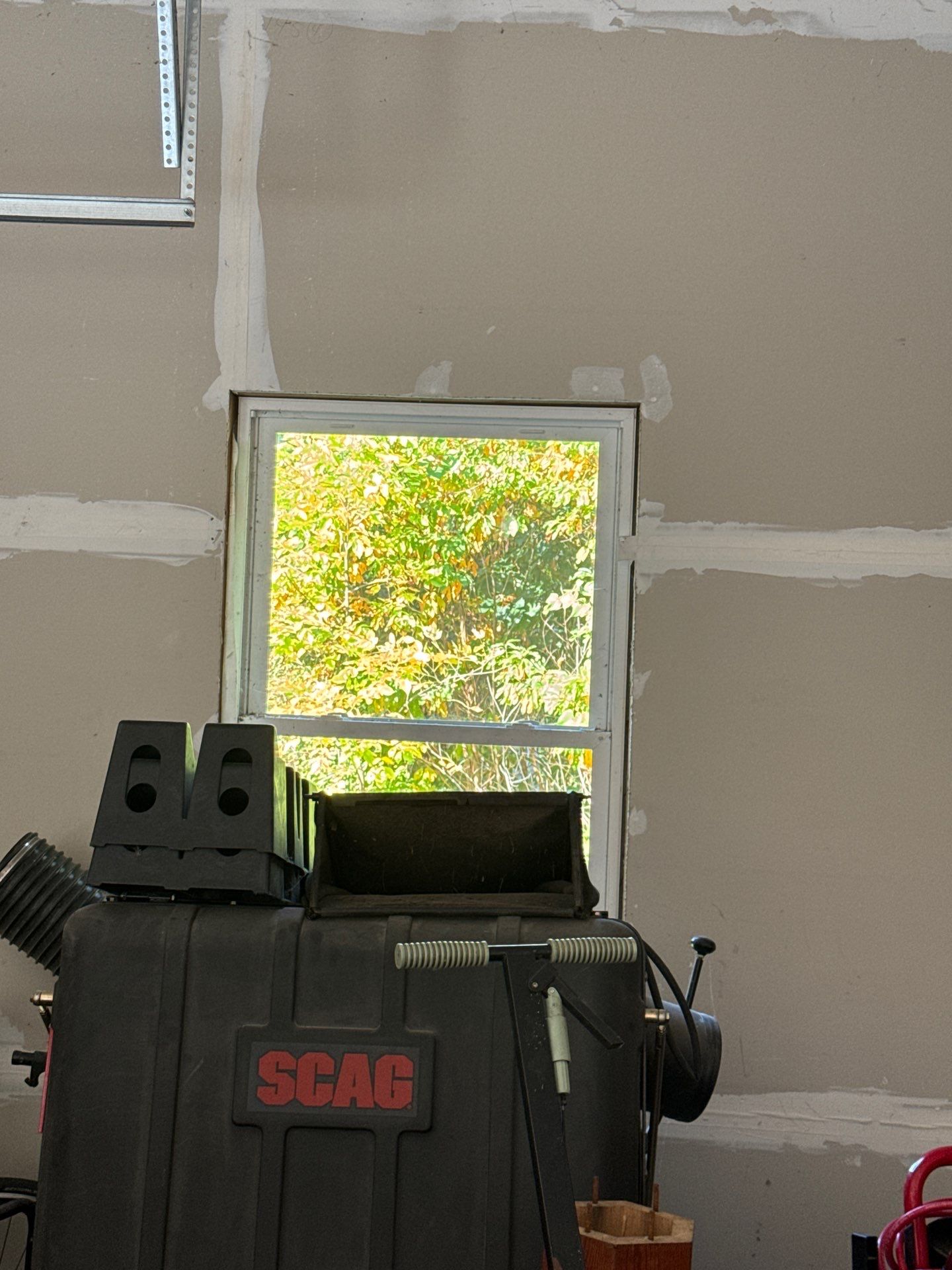 Hudsonville Garage Renovation Featuring Finished Drywall and Flake Epoxy Floors by Gordon Painting