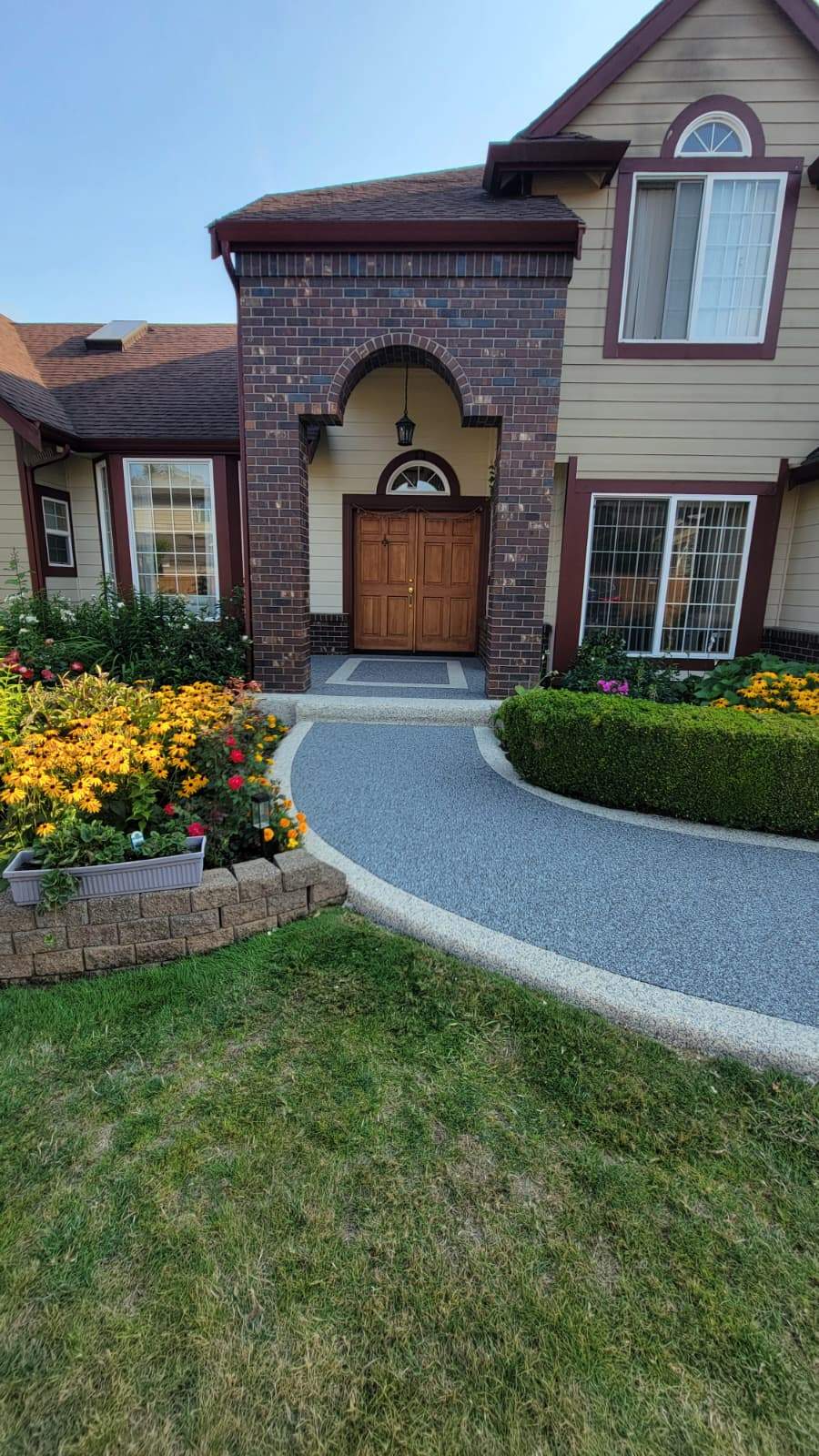 Elegant Walkway and Patio in Palazzo and Santorini Vuba Stone  by Concrete Coating Experts Inc.
