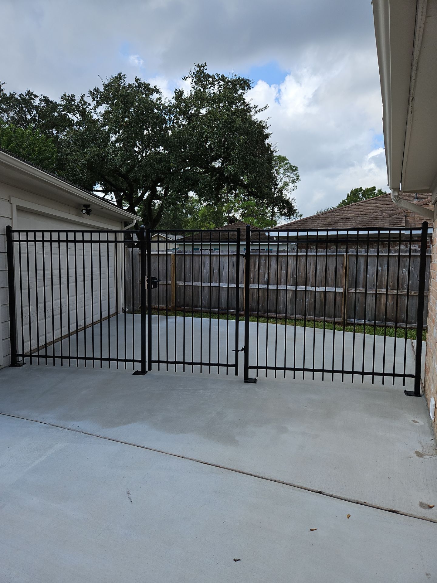 Iron fence installation using 6ft - 3 Rail - Ameristar Montage by Tim's Fences