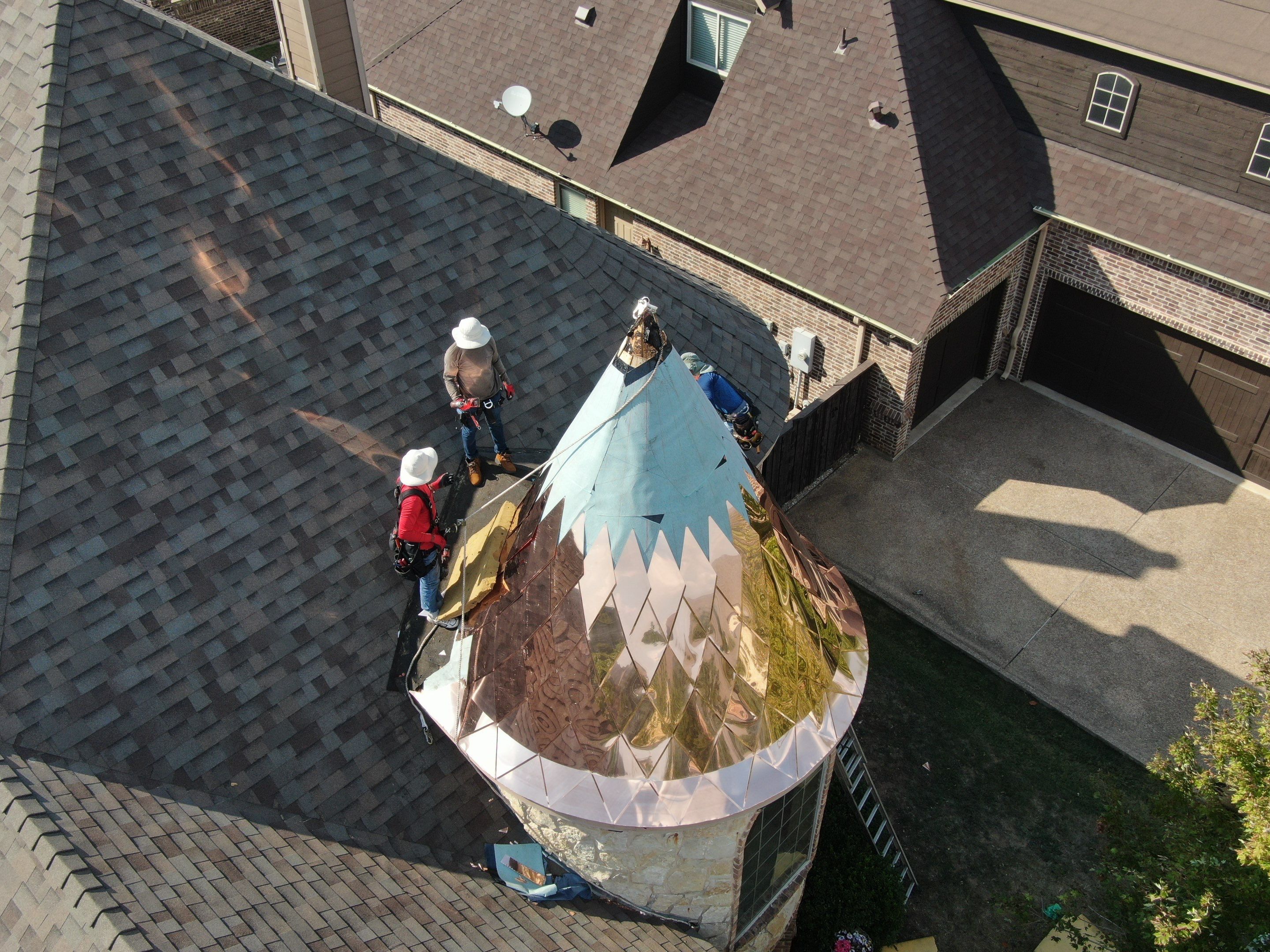 Installing Custom copper turret and Malarkey Vista Class 4 shingles Hail Damage Upgrade by Becker Roofing and Exteriors