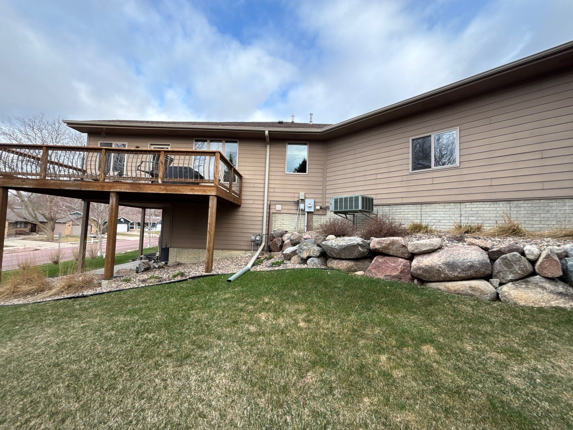 Multi-Story Residential Exterior Painting and Siding Refresh in Sioux Falls by Select Painting, Coatings & Garage Cabinets
