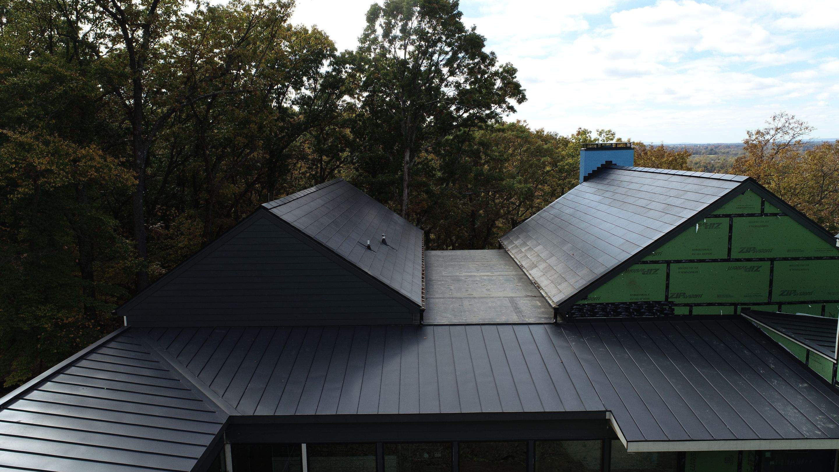Roof Installation using Tesla Solar Roof V3 by American Home Contractors