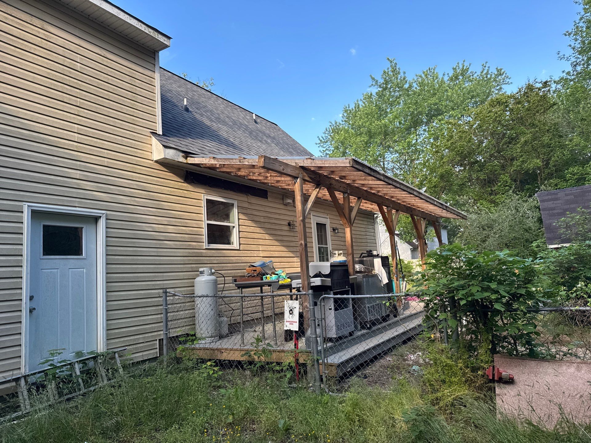 Gloucester Exterior Overhaul with Navy Blue Siding and New Roof by Cade Construction
