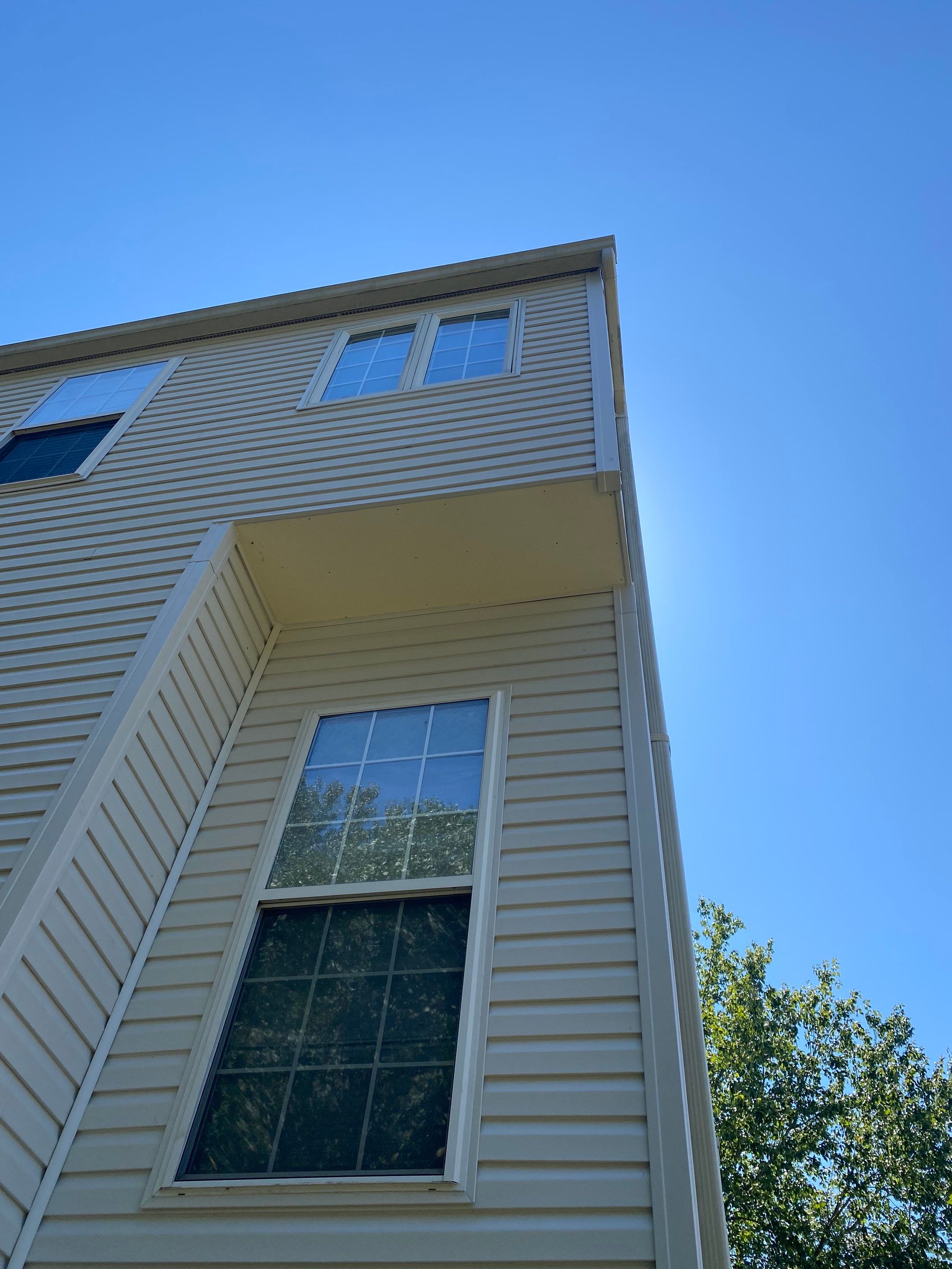 Woodbridge: Siding Replacement with Mastic Ovation Vinyl siding in Linen  by RM Banning, Inc.