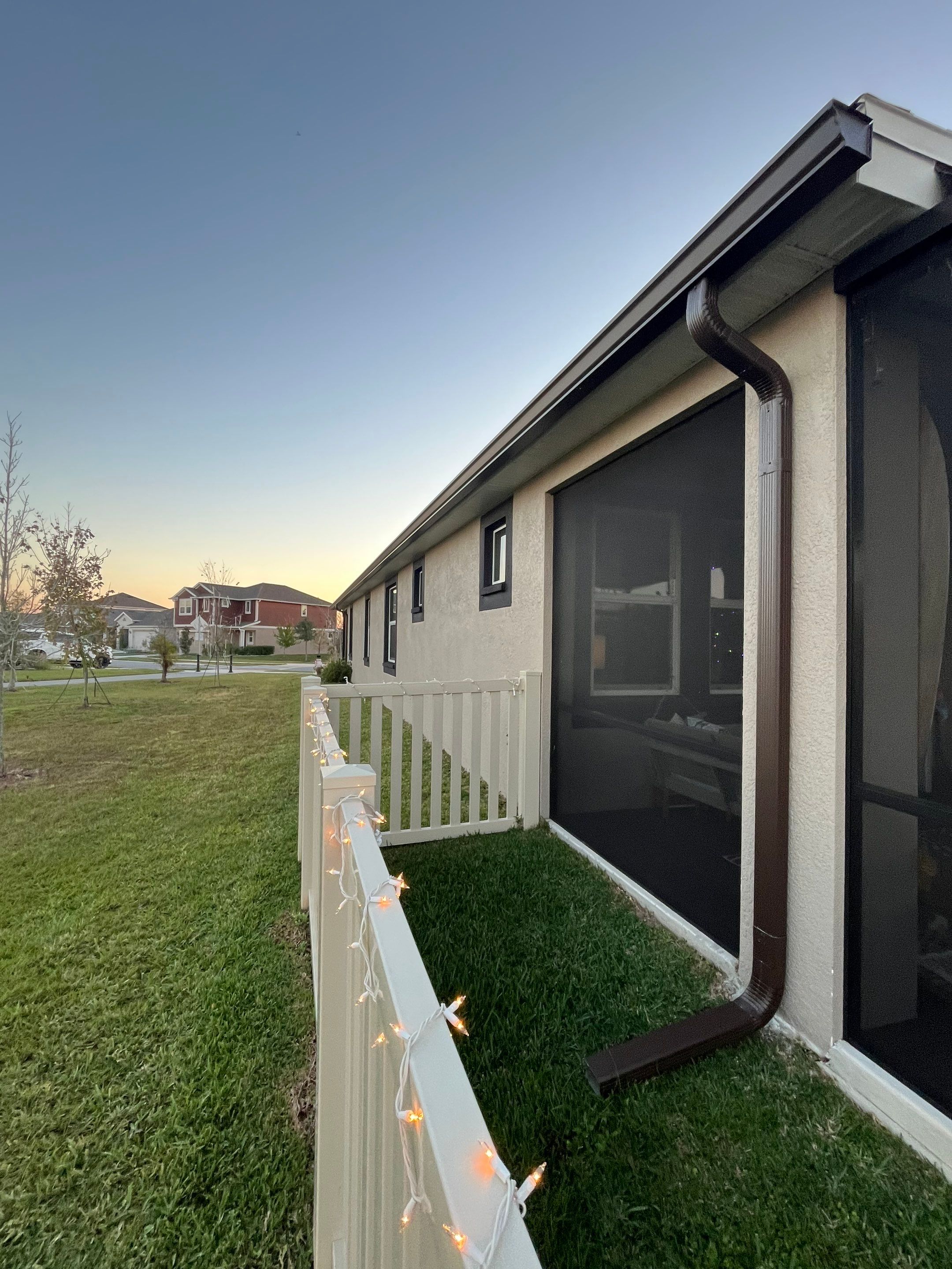 3X4 elbow Downspouts using Musket Brown Seamless Gutters in Lakeland FL by Gutter Professors