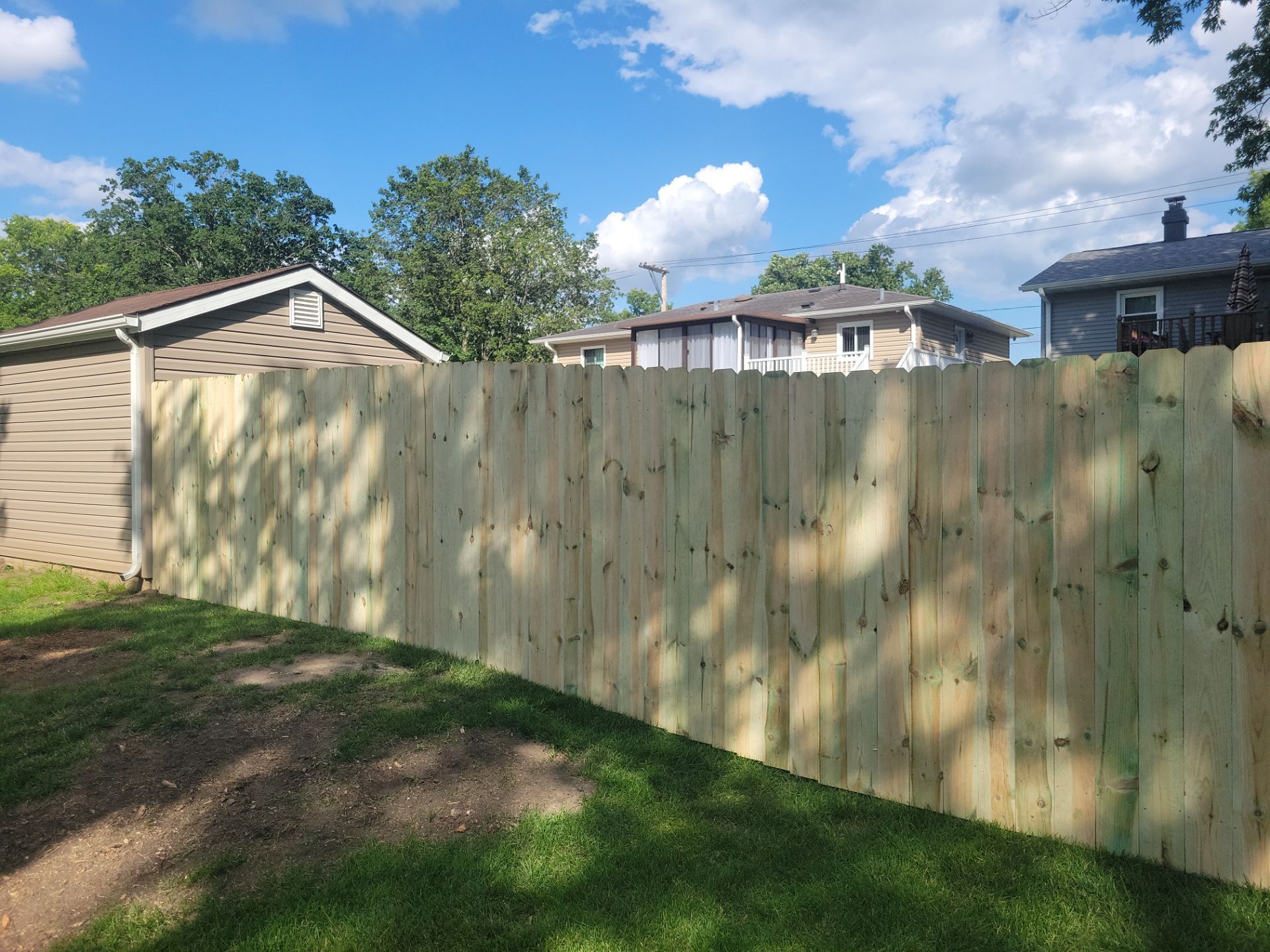 Pressure-Treated Pine Privacy Fence and Custom Gates in Waterloo by Perfect Picket Fence and Stain