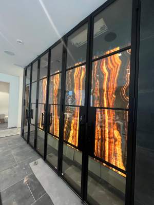 Custom Black-Framed Glass Wine Cellar Installation in Dallas