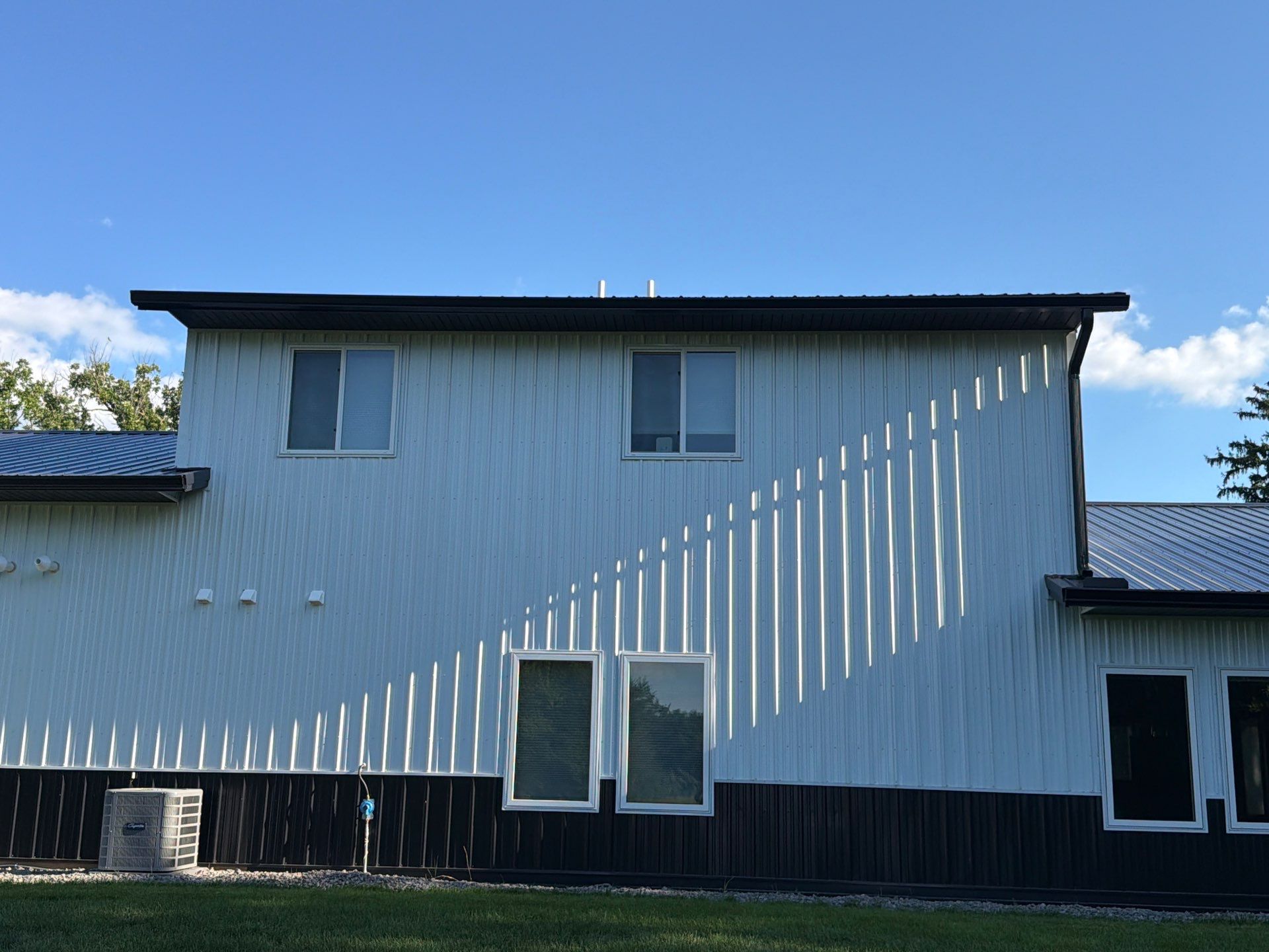 Black Seamless Gutter Installation for barndominium in Buffalo by Next Level Seamless Gutters / Exteriors Inc.