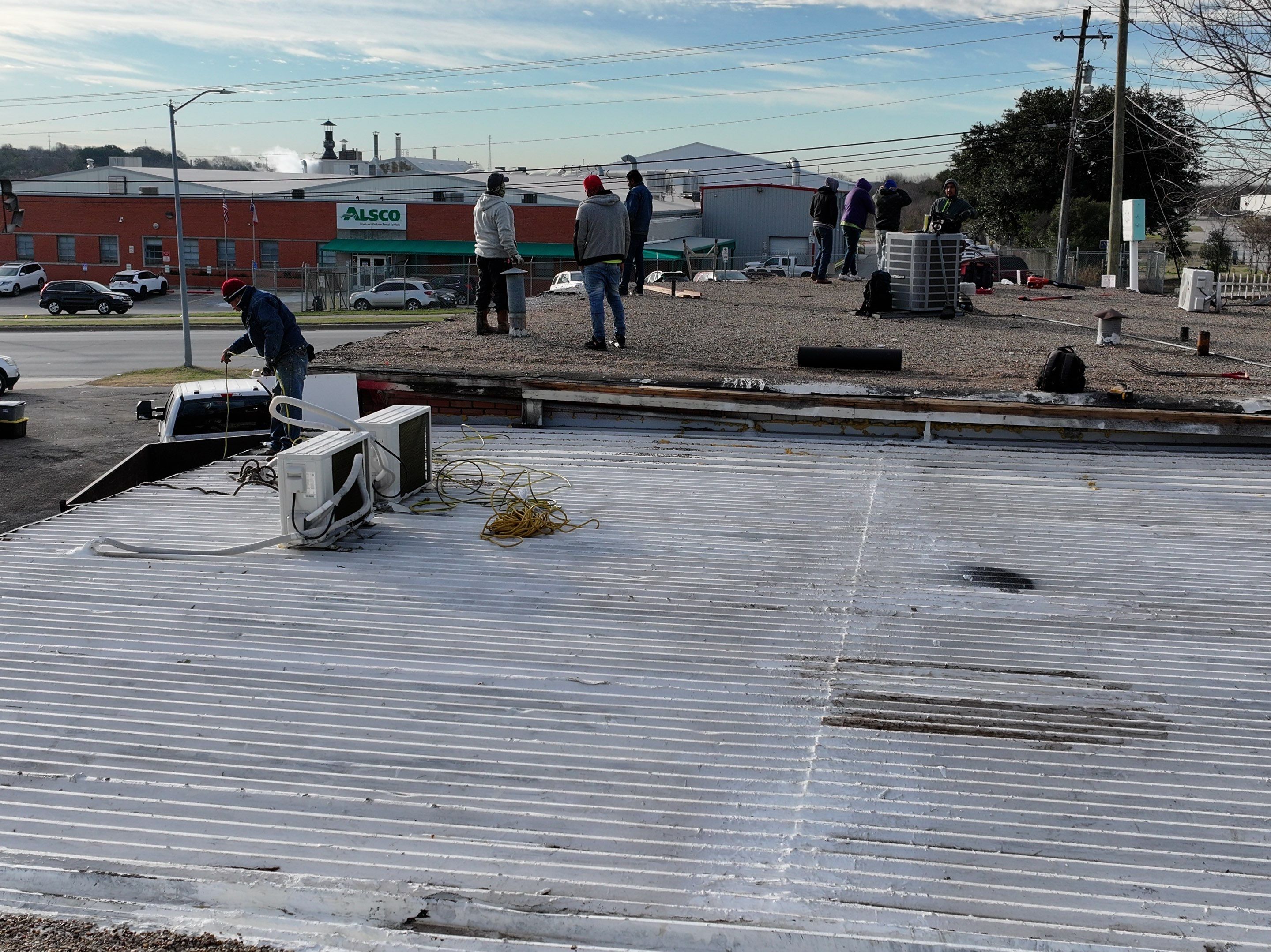 Commercial roofing overlay using GAF TPO over an old ballast roof by Becker Roofing and Exteriors
