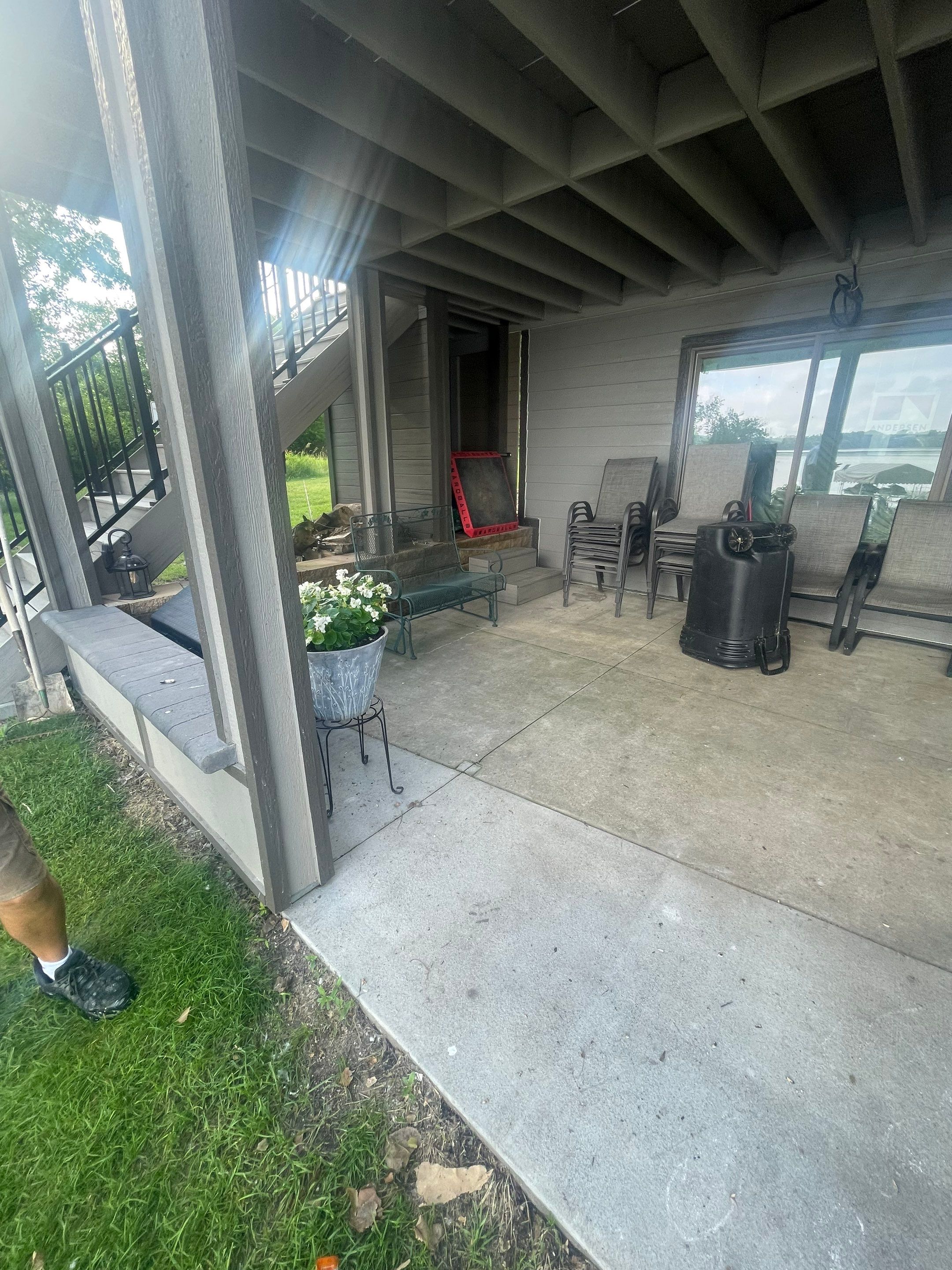 Lakefront Screened Patio Concrete Coating Installation in Wentworth by Select Painting, Coatings & Garage Cabinets