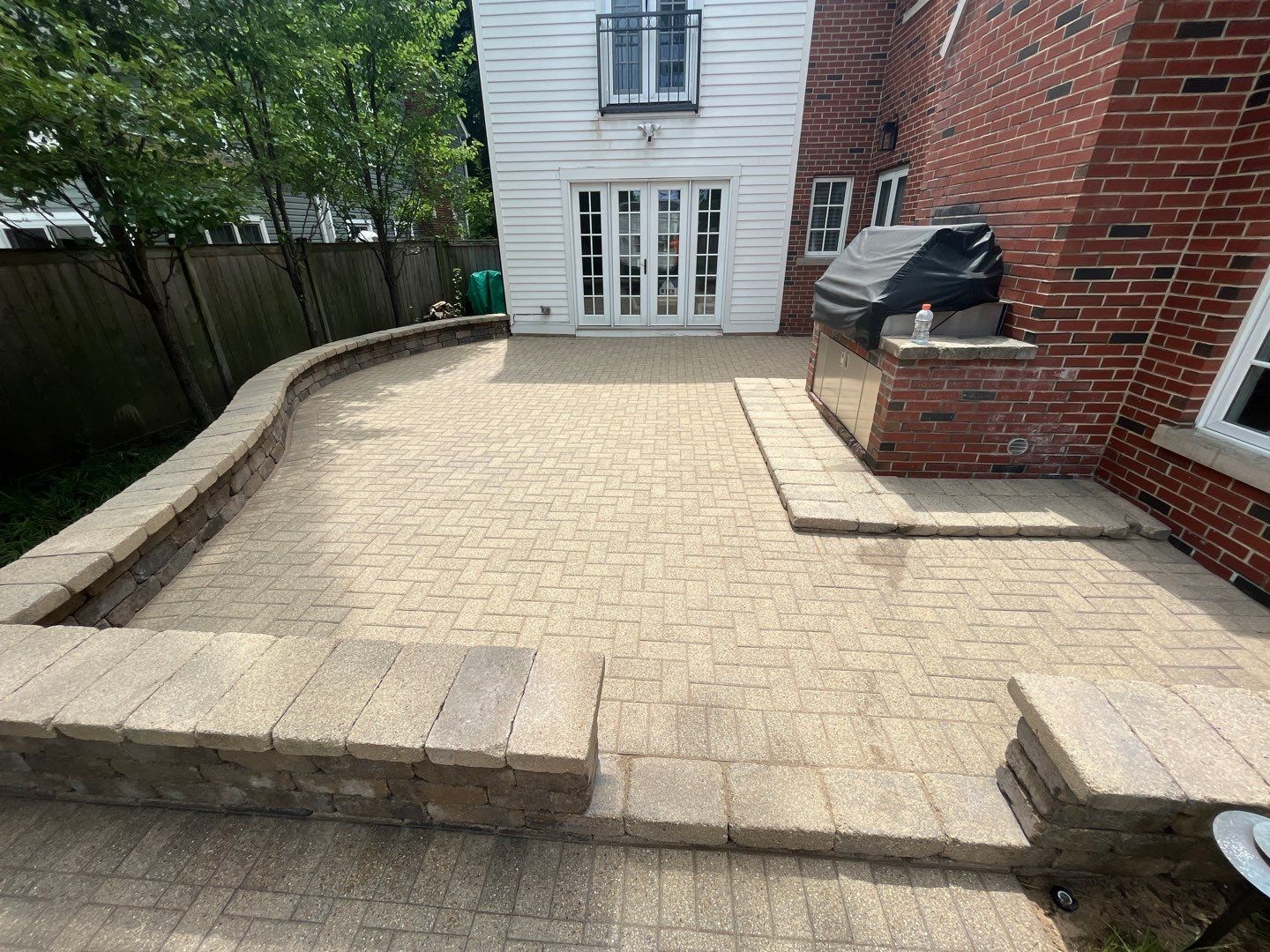Brick patio repair, clean sand and seal by Northern Power Washing LLC.