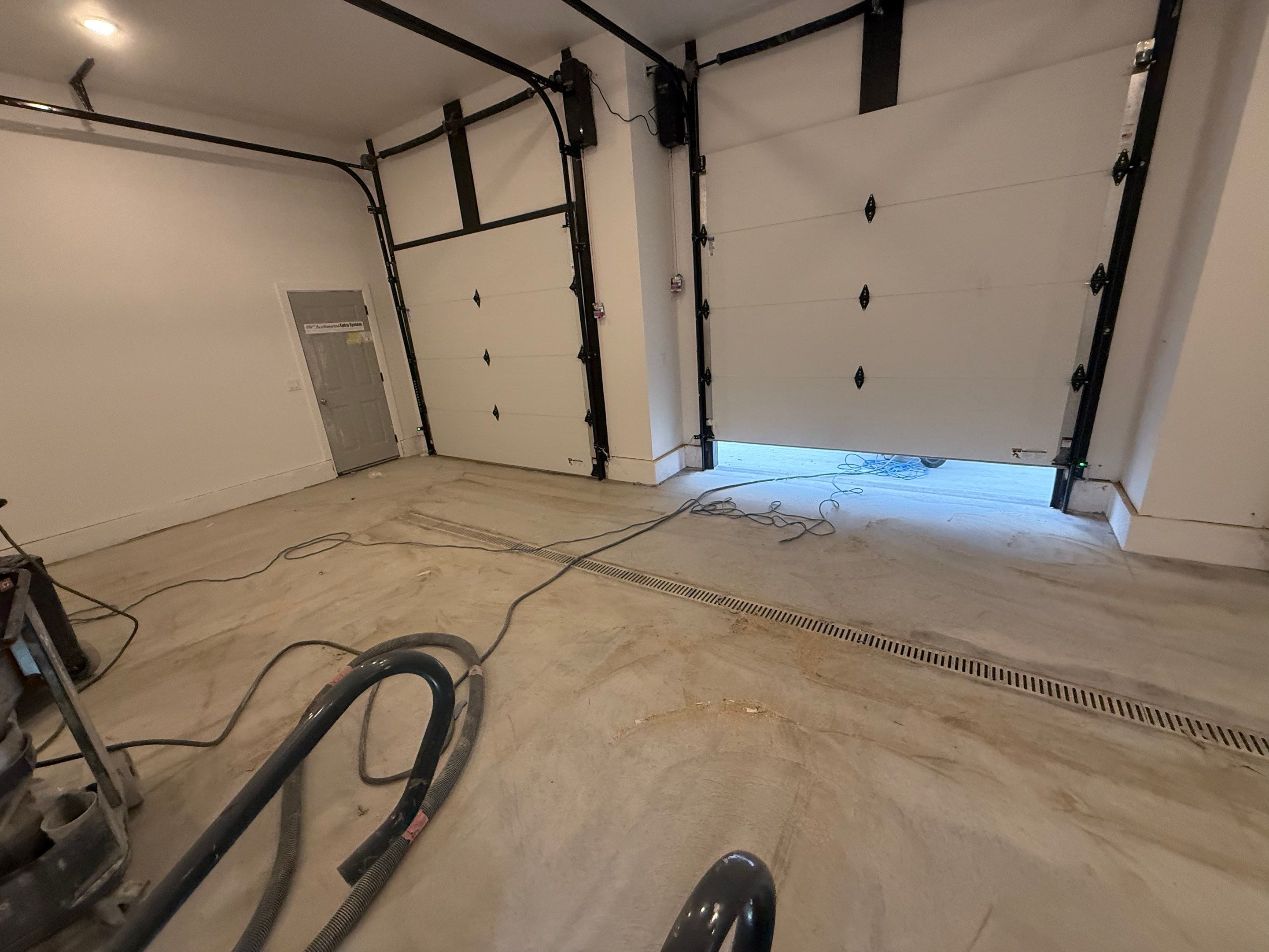 Multi-Car Garage Epoxy Floor Coating and Concrete Finishing in Sioux Falls by Select Painting, Coatings & Garage Cabinets
