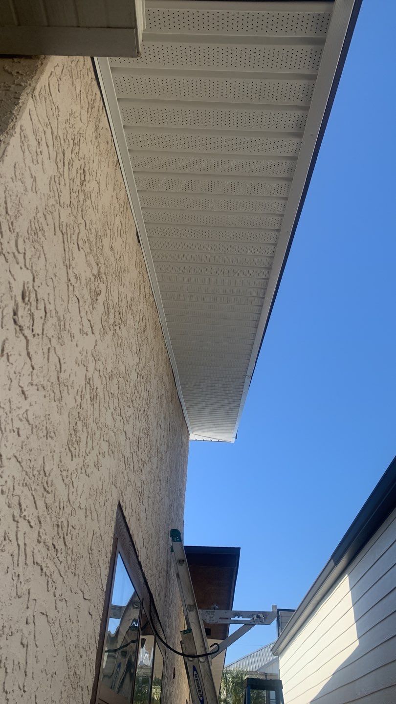 Soffit and Fascia Installation Using White Vinyl Soffit and Musket Brown Fascia by Gutter Professors