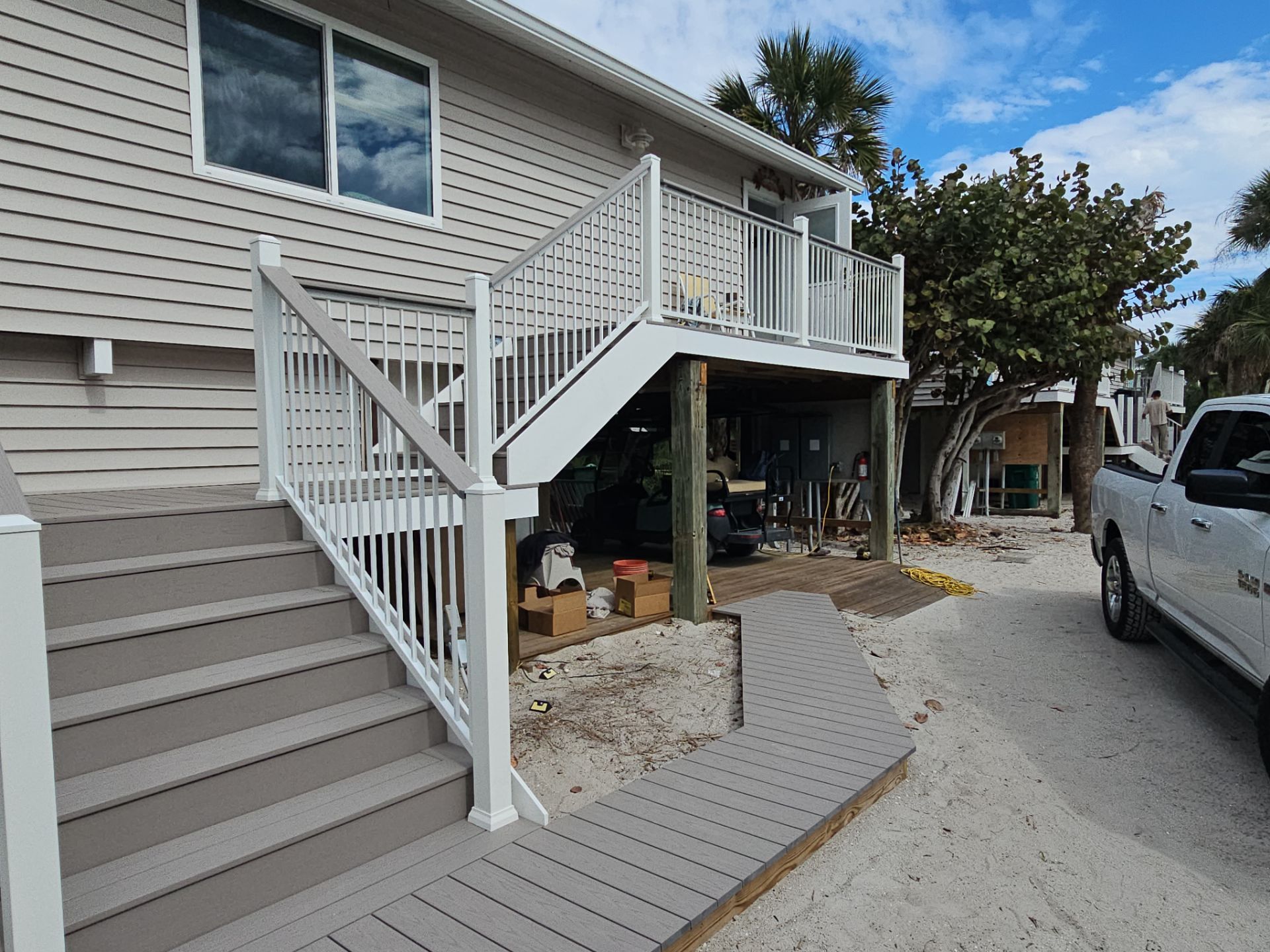 Elevated Composite Deck and Symmetrical Staircase Replacement in Englewood by Smirnov Construction Inc