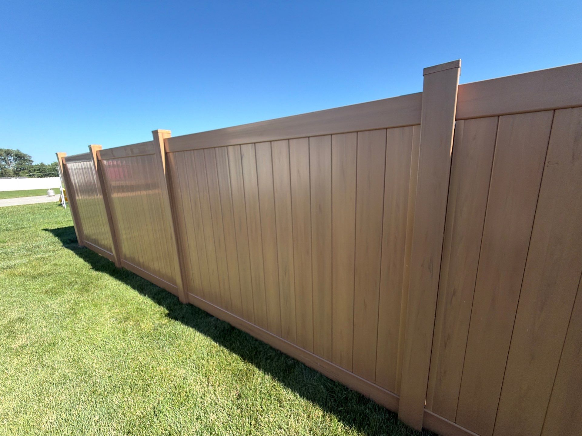 Residential Cypress Vinyl Privacy Fence Installation in Cedar Falls by Perfect Picket Fence and Stain