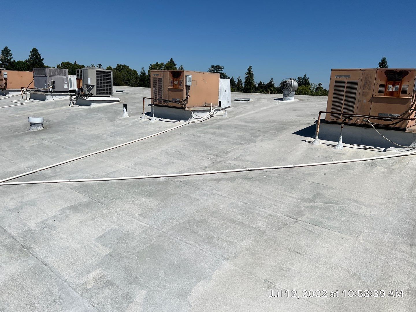 MR Roofing system using Benchmark/PUMA XL coatings over TPO single-ply roofing by Straight Edge Roofing Inc