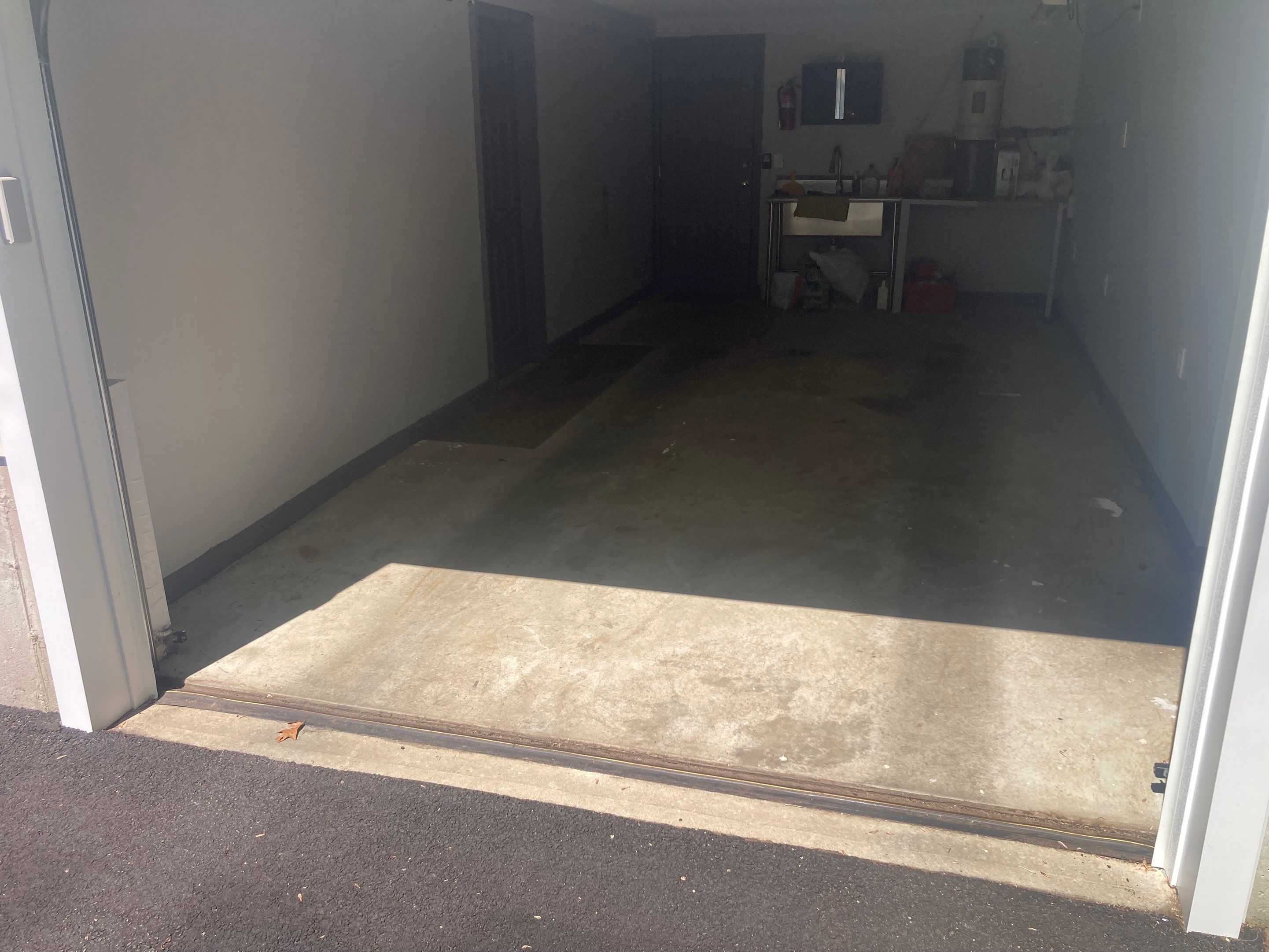 Concrete Floor Coating Transformation by DiGiorgi Roofing and Siding Inc