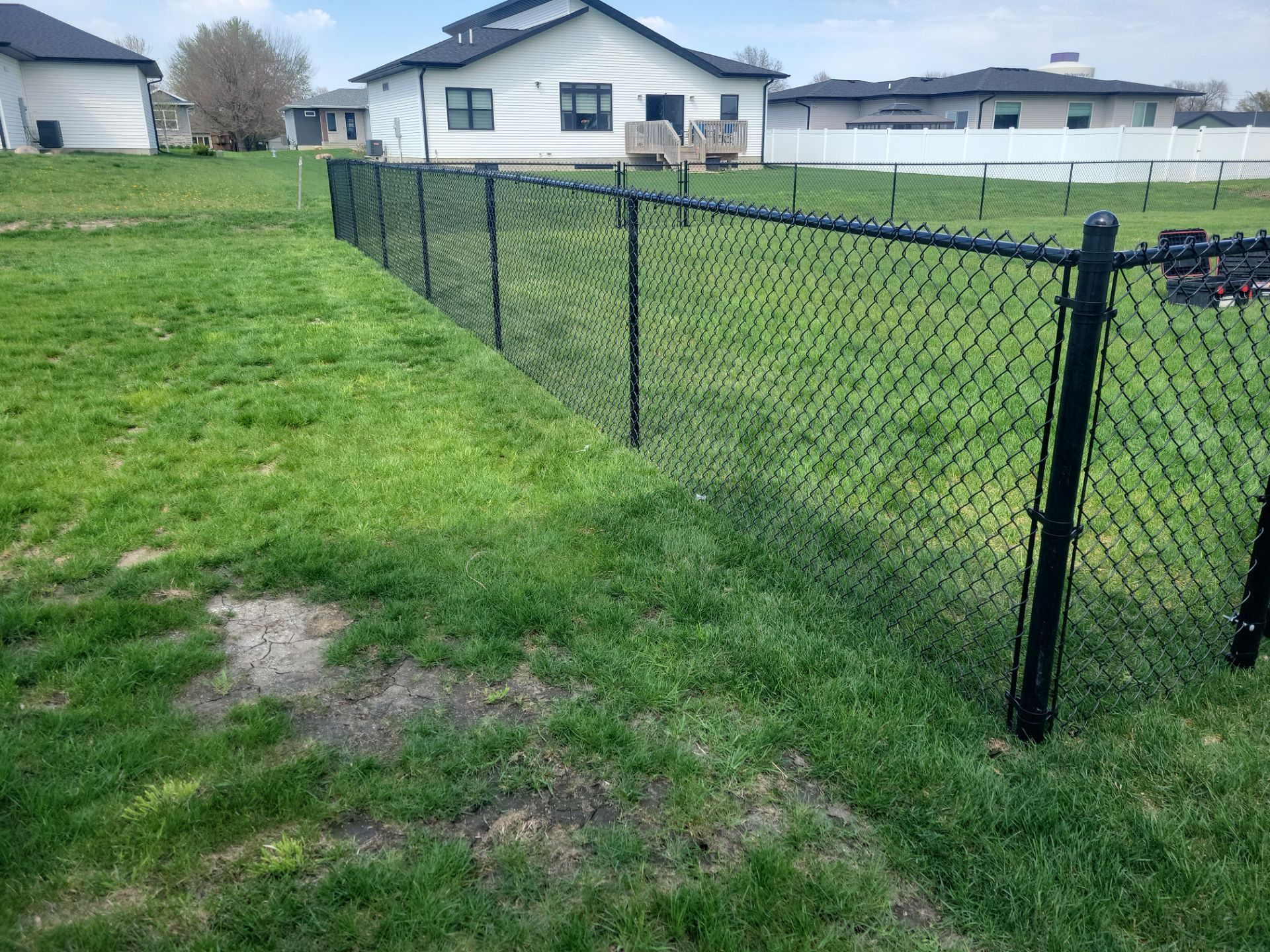 Black Chain Link Fence and Gate Installation in Cedar Falls by Perfect Picket Fence and Stain
