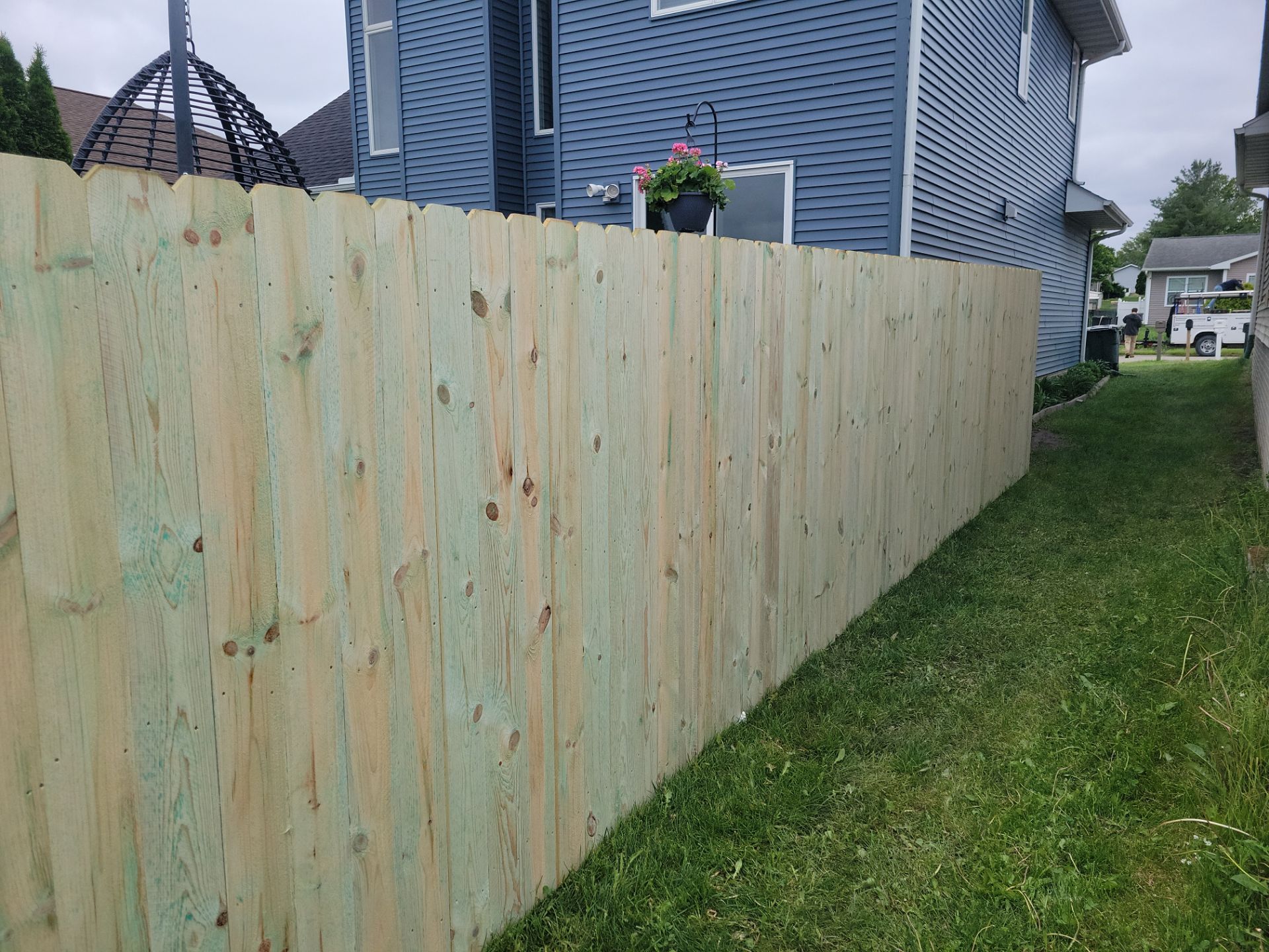 Pressure-Treated Wood Privacy Fence Installation in Waterloo by Perfect Picket Fence and Stain