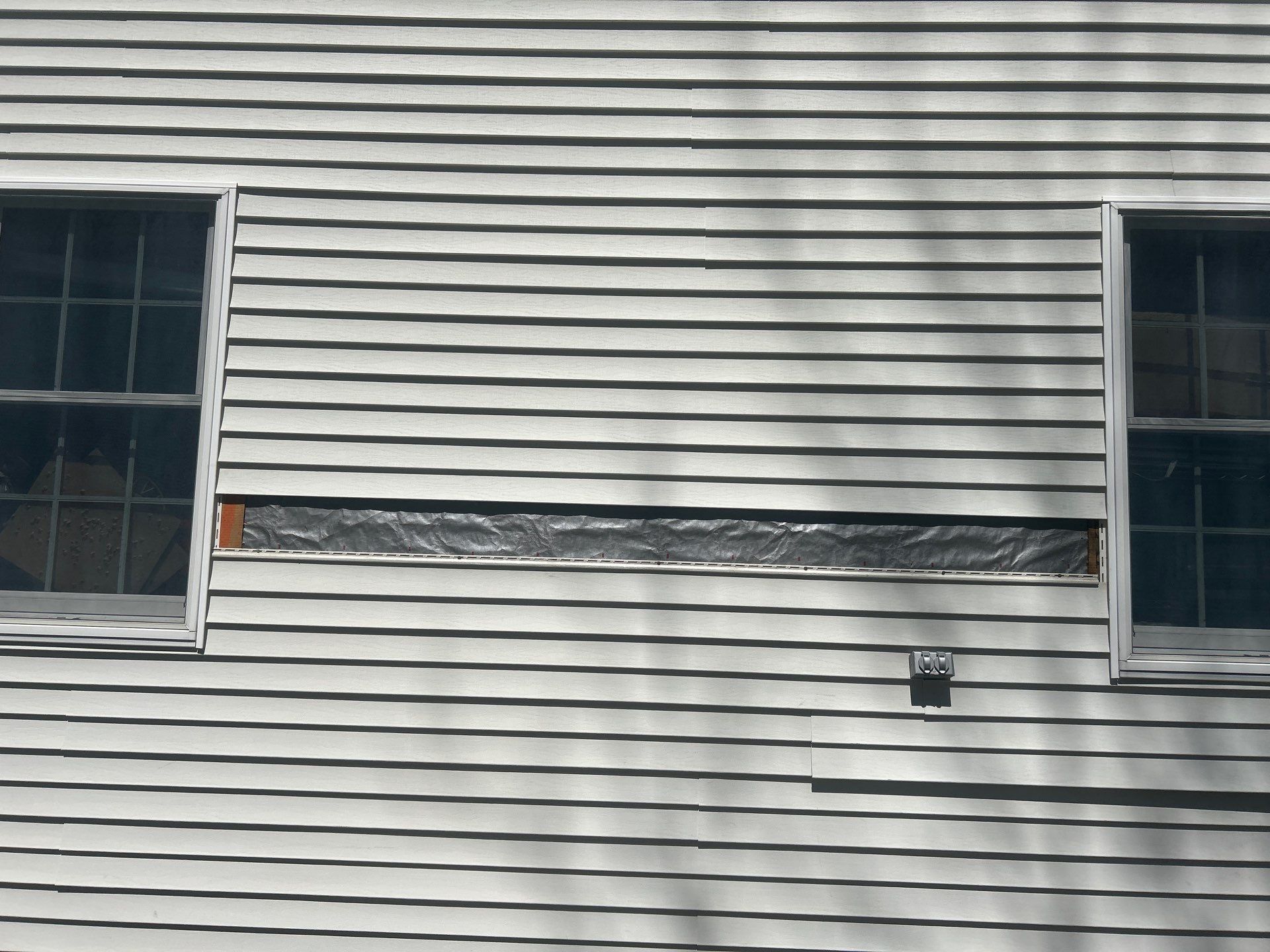 Vinyl Siding Repair with Spot Replacement by Mighty Dog Roofing of Greater Middlesex County