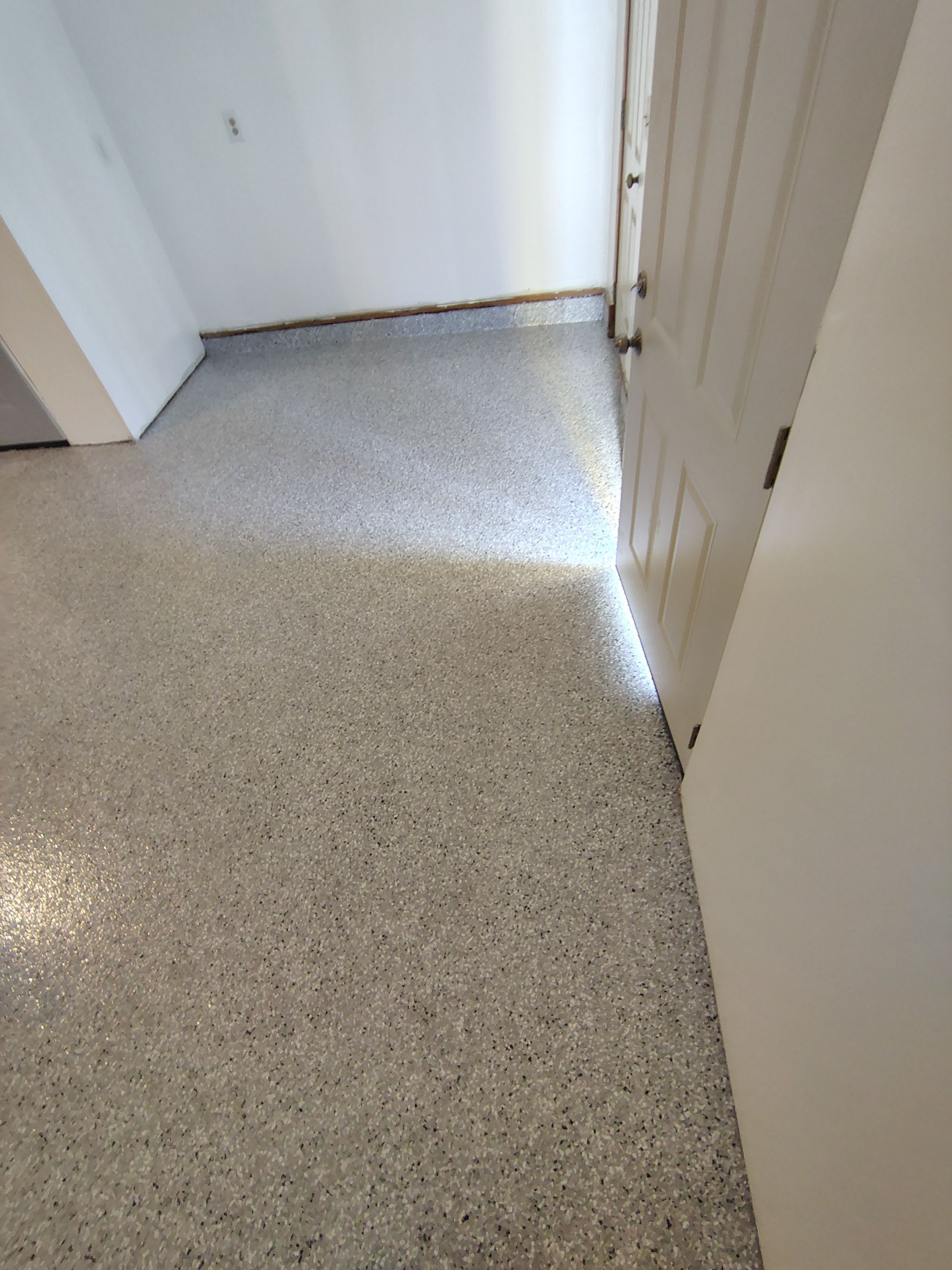 Decorative Chip Concrete Coating Installation in Luverne by Select Painting, Coatings & Garage Cabinets