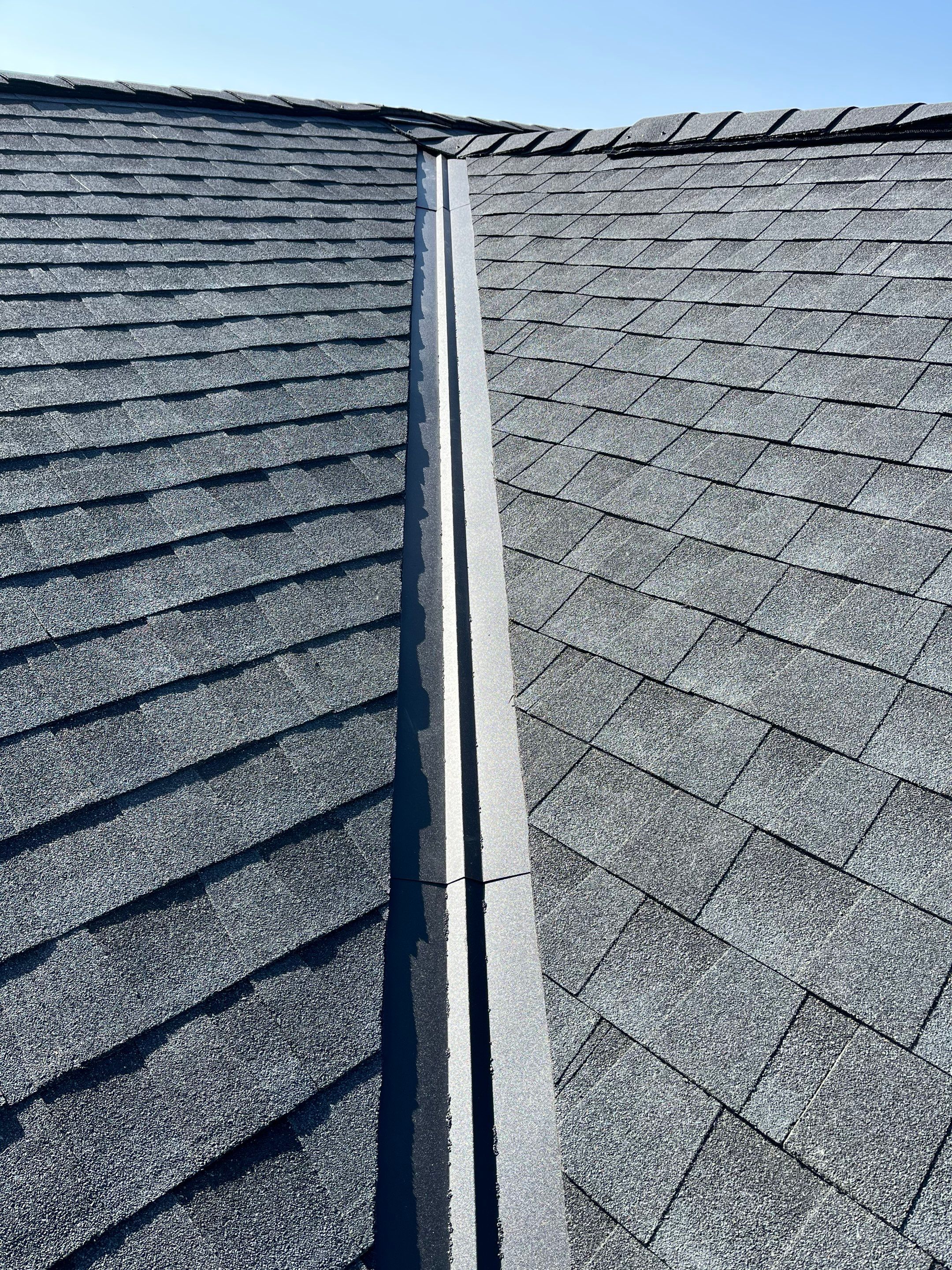 Residential Roofing Installation using Asphalt GAF HDZ in Charcoal by Artisan Roofing & Home Improvements Inc.