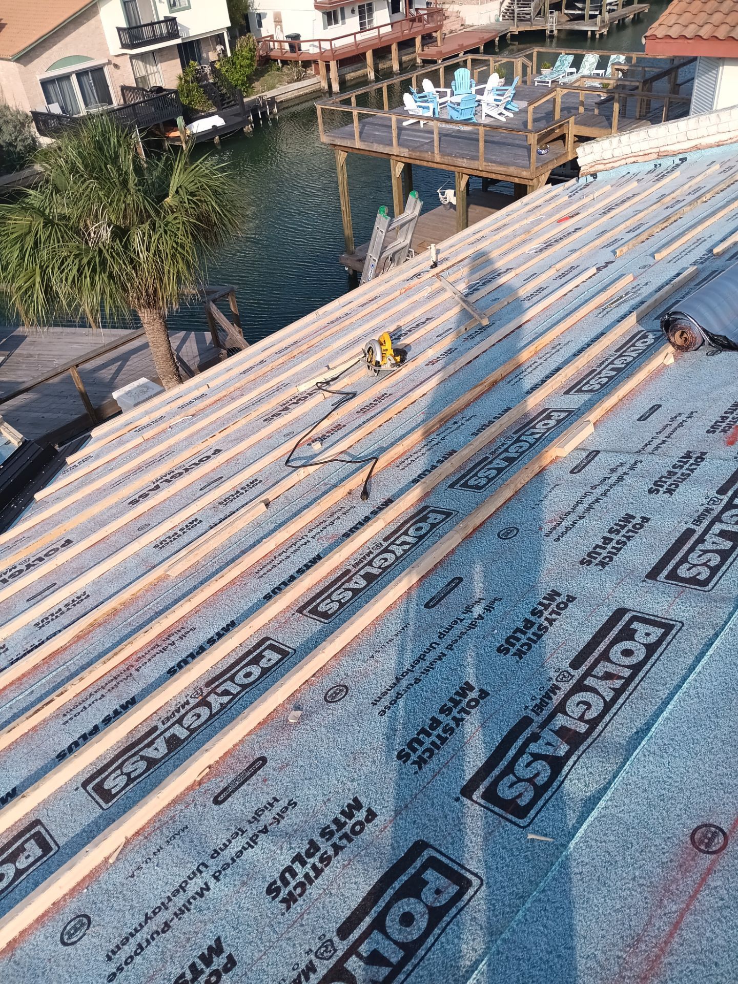Off with the Tile and on with the TILCOR stone coated metal.  by Bayfront Roofing and Construction