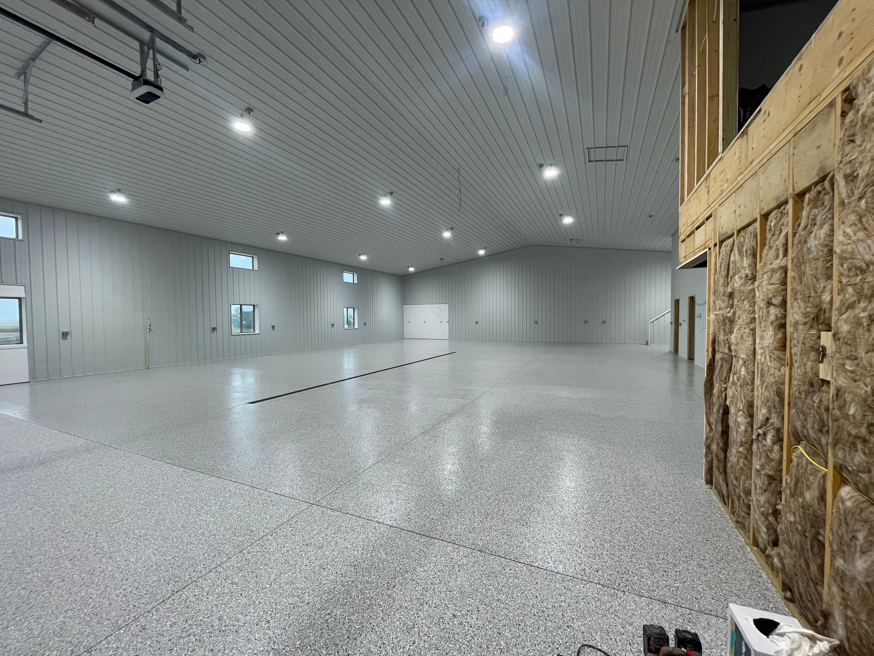 Custom Speckled Floor Coating for Large Montrose Shop by Select Painting, Coatings & Garage Cabinets