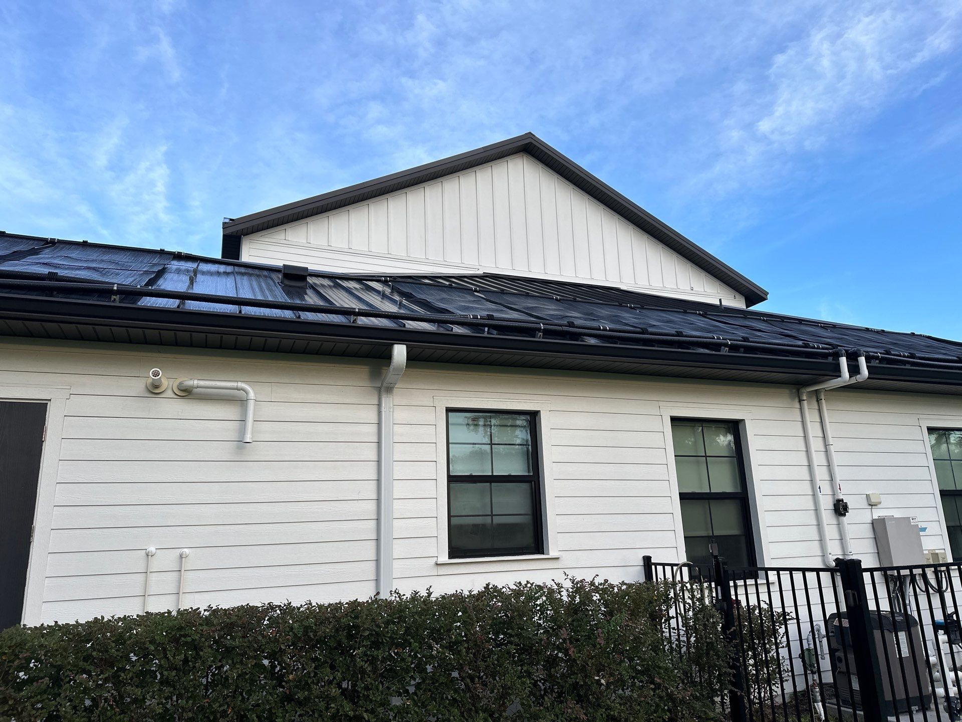 Complete Two-Story House Wash and Driveway Cleaning in Winding River Community, Bradenton, FL by Sunshine AquaWash