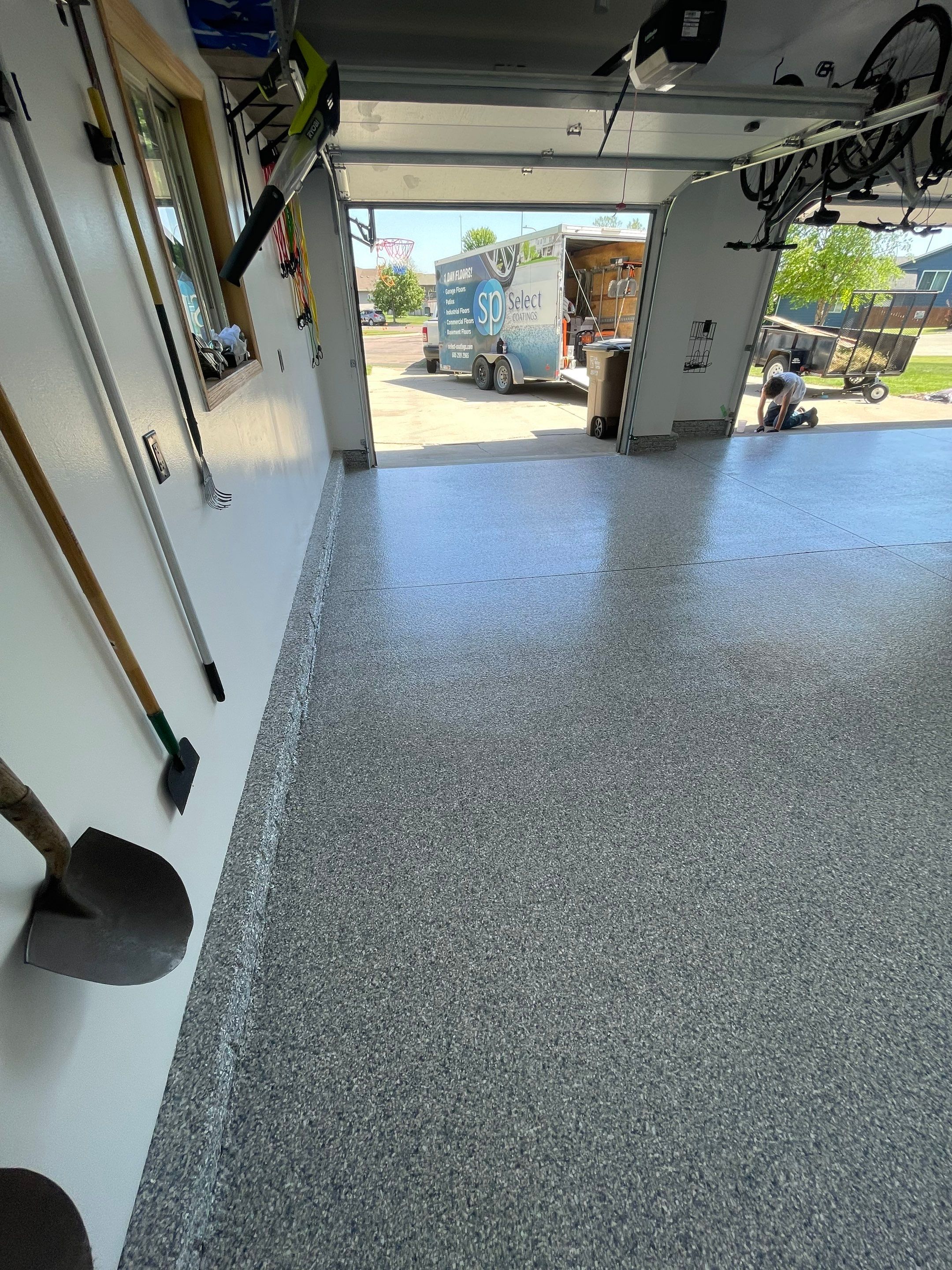 Tidal Wave Flake Garage Floor Installation in Sioux Falls by Select Painting, Coatings & Garage Cabinets