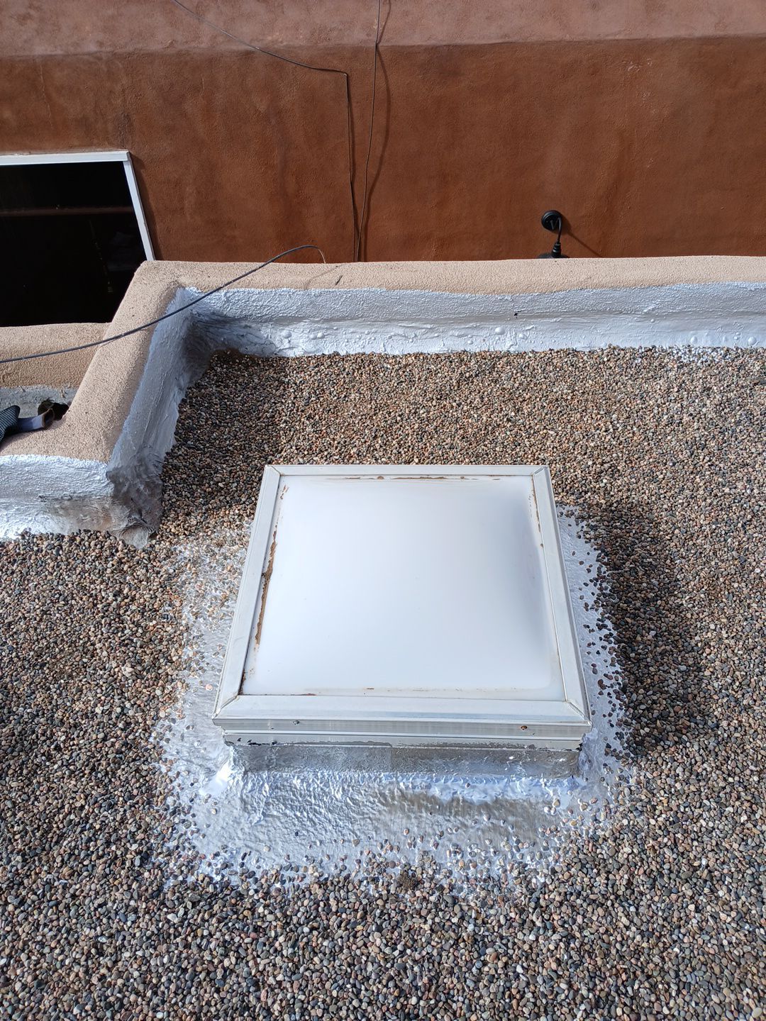 Roof Maintenance and Low-E Tempered Glass Skylight Replacement on Gravel Roof in Northwest Albuquerque by Doyle Roof Masters Inc