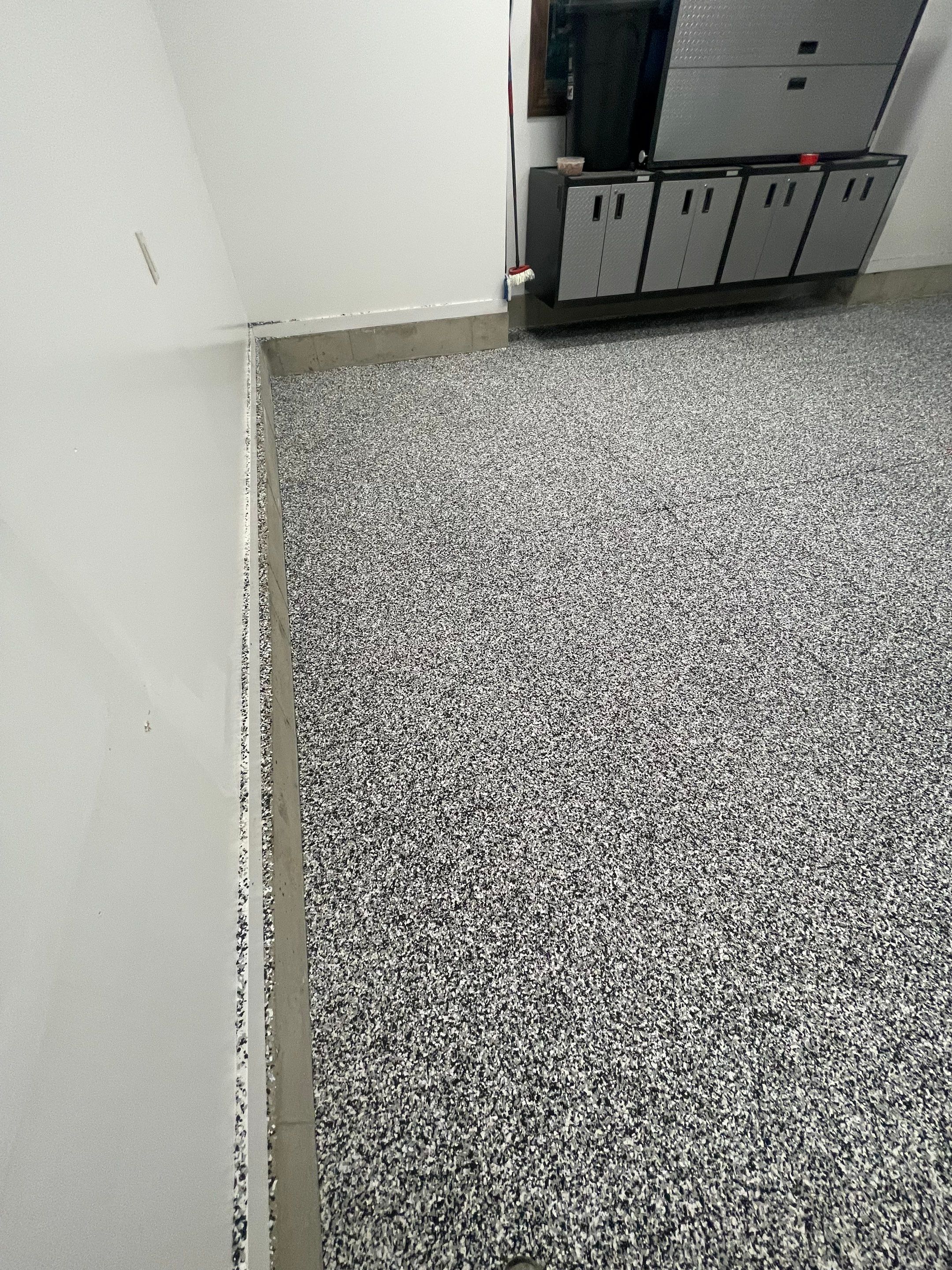 Garage Floor Coating and Domino Flake Finish in Sioux Falls by Select Painting, Coatings & Garage Cabinets