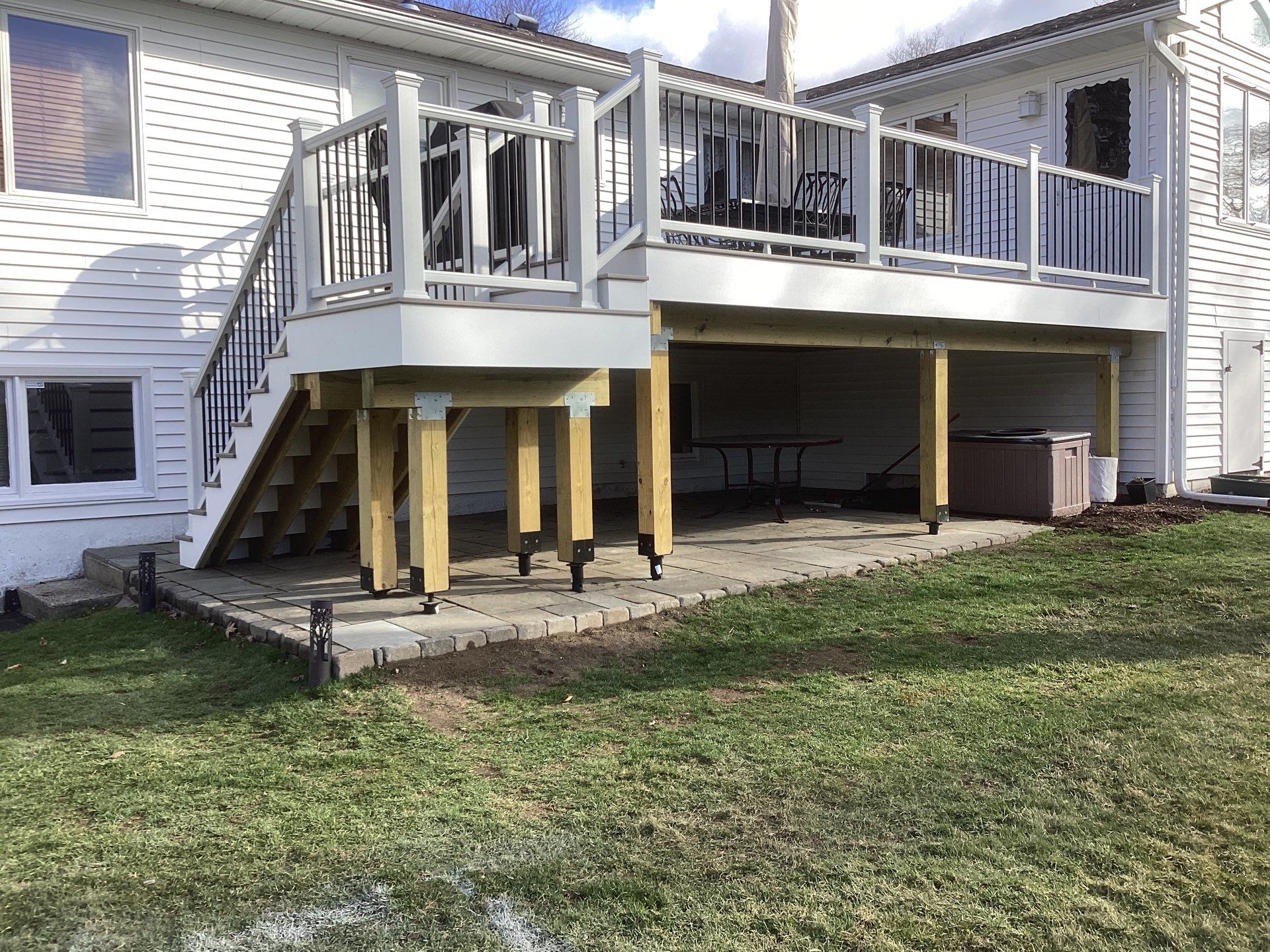 New Deck, Trex Biscayne deck boards, composite railings with black round balusters by DiGiorgi Roofing and Siding Inc