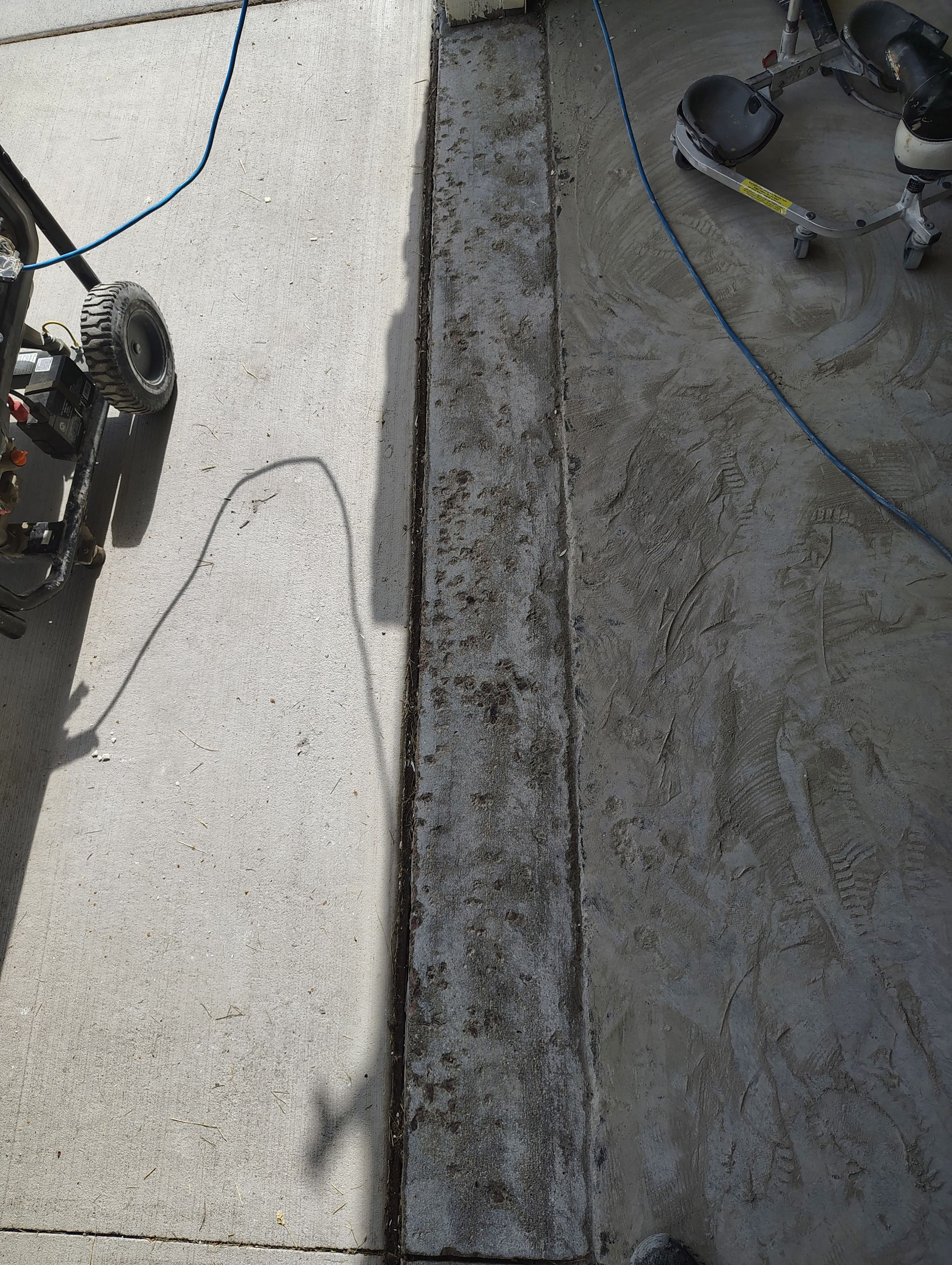 Custom Grey Speckled Epoxy Floor Coating for Sioux Falls Garage by Select Painting, Coatings & Garage Cabinets