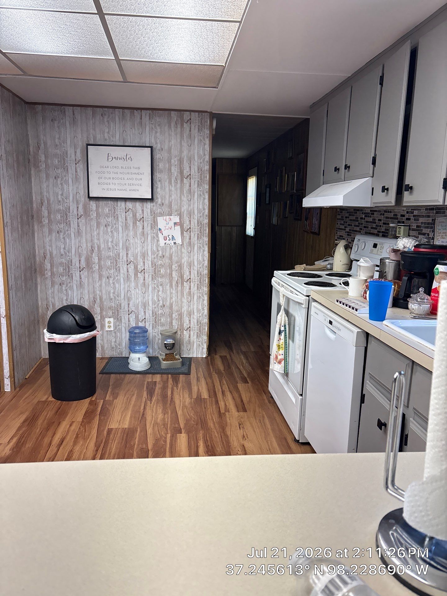 Kitchen Remodel Featuring Vinyl Plank Flooring and Wood Paneling in Attica by CompanyCam Sales Demo