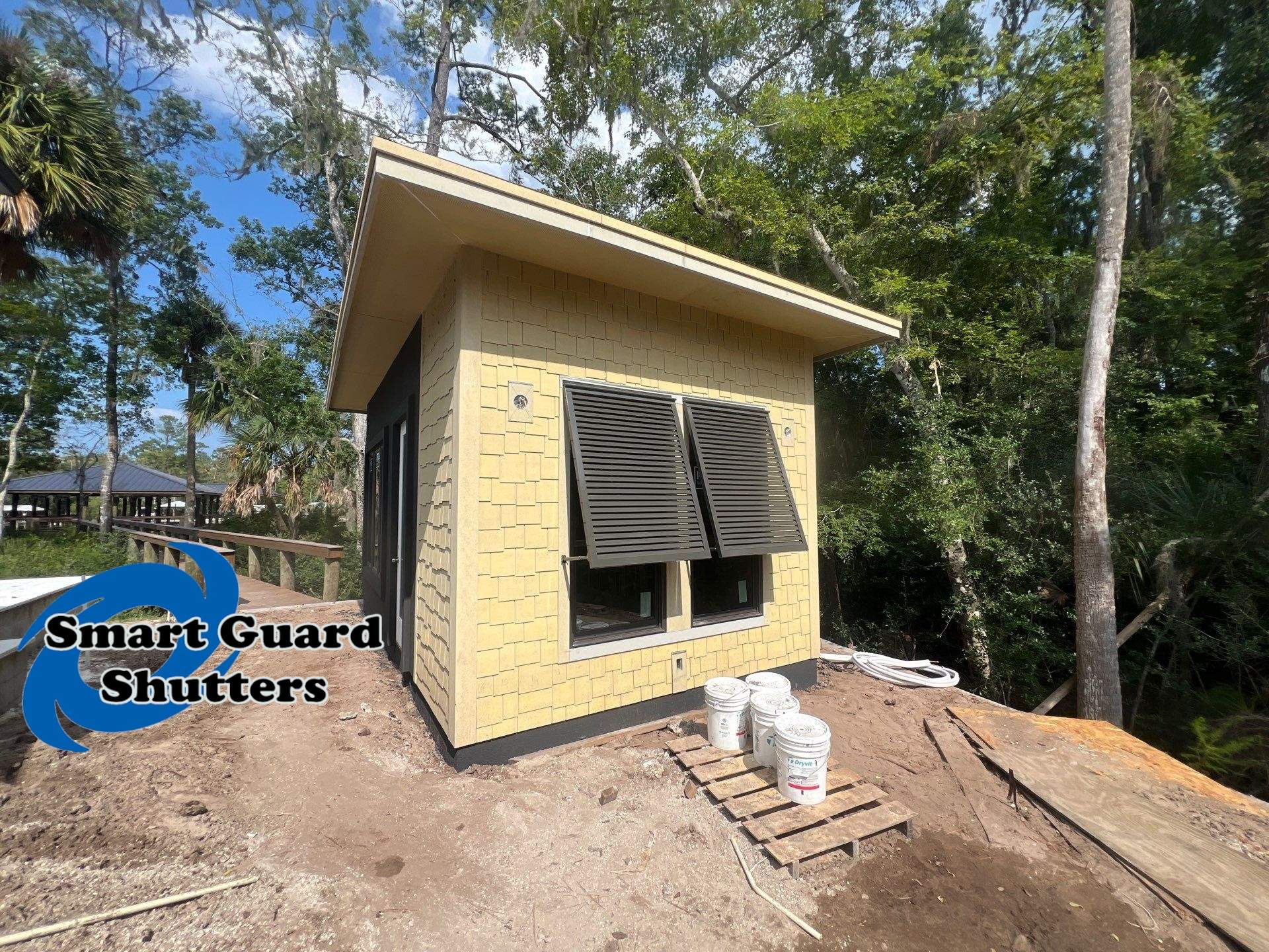 Decorative Shutters in Umbra Grey by Smart Guard Shutters
