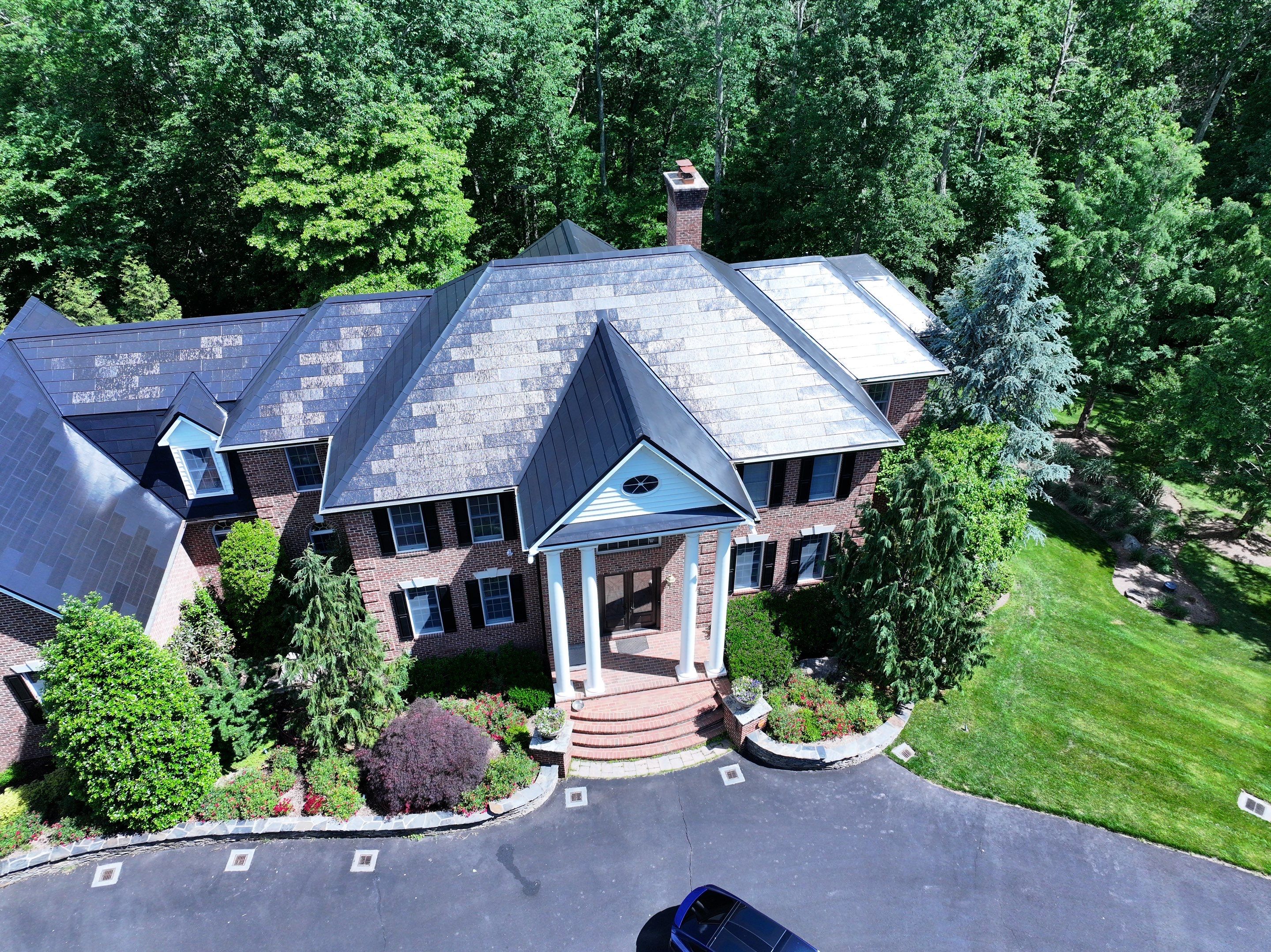 Tesla Solar Roof Replacement by American Home Contractors