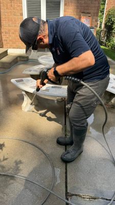 Residential Concrete Sidewalk Installation and Patio Power Washing in Maple