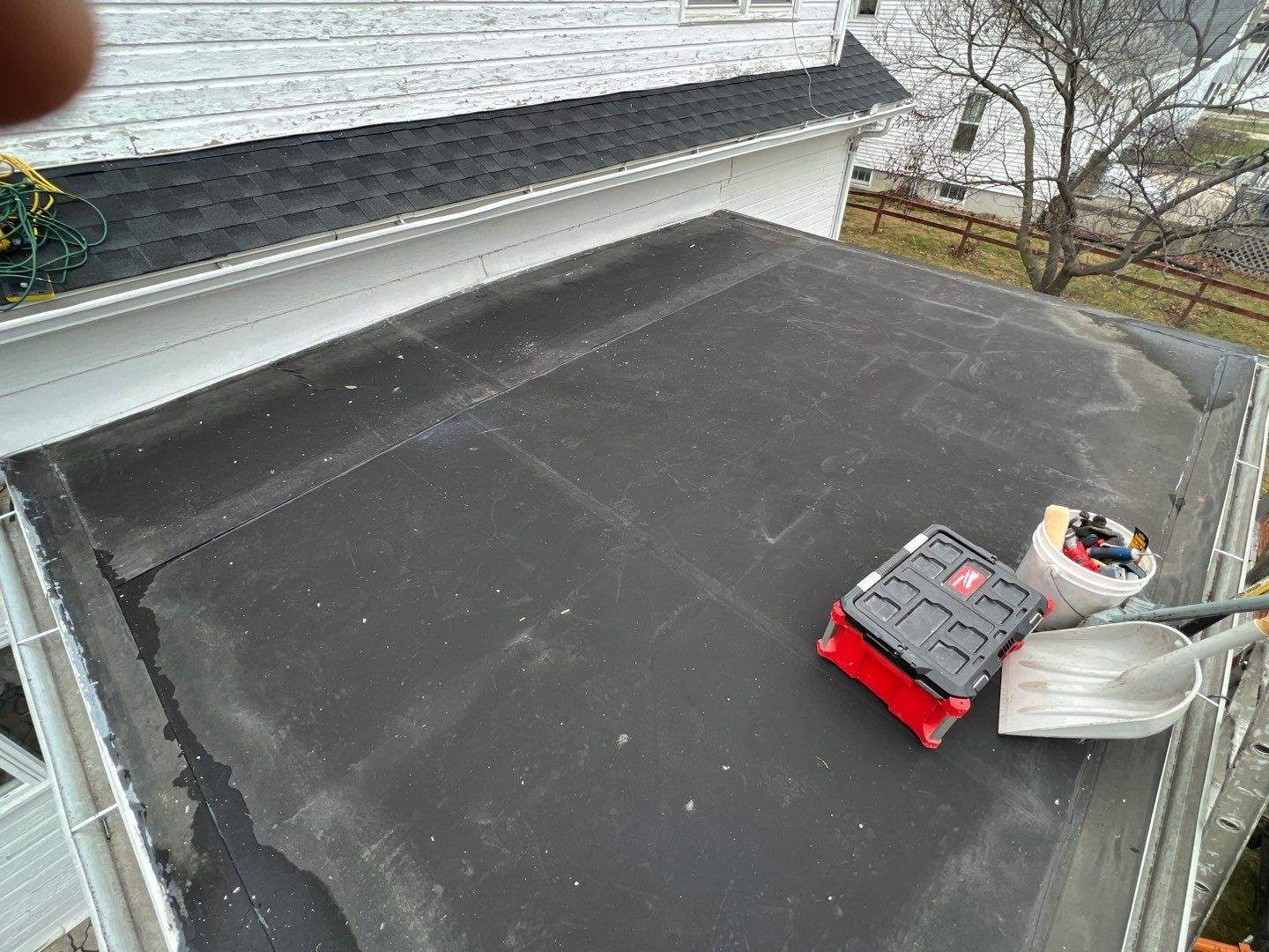 Residential Roofing Installation using 60 mil rubber roof by Nitro Roofing and Construction