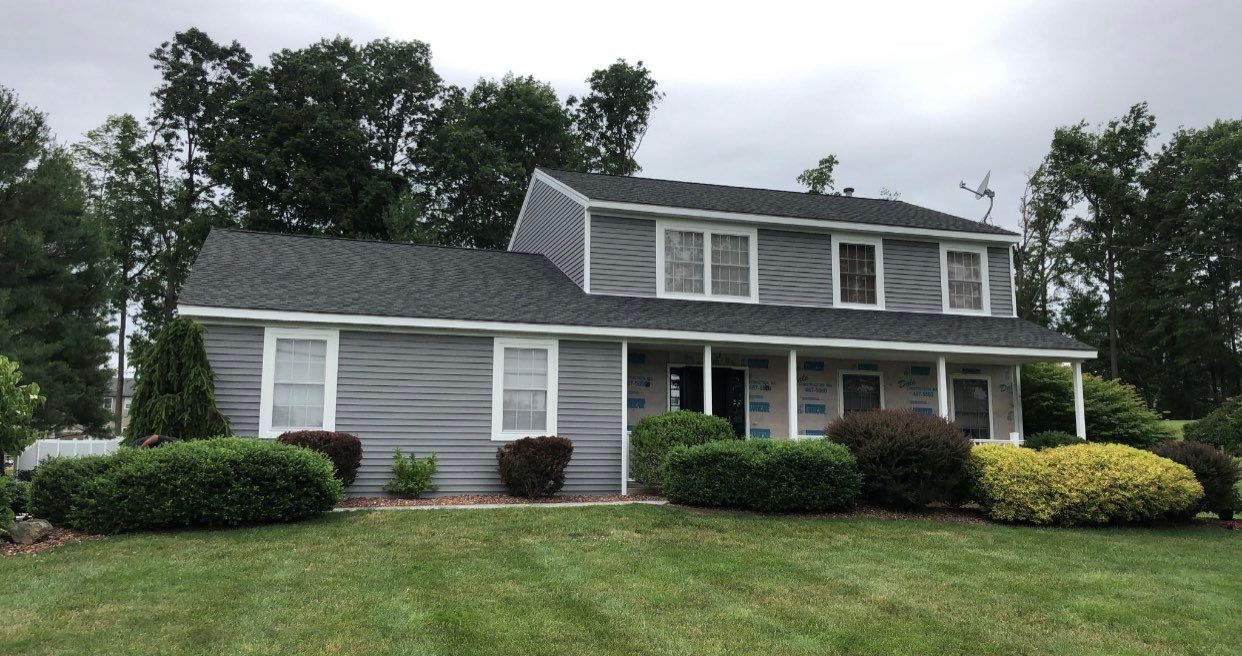 Siding Installation using Certainteed Monogram Charcoal gray and Owens Corning Versetta Stone Sterling by A Plus Exterior